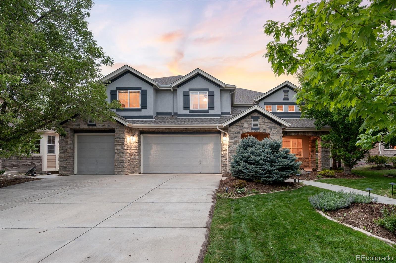 Set along the #11 fairway of the Broadlands Golf Course in Broomfield, this home opens with light, volume, and a calm sense of ease. A generous covered front porch leads into a dramatic two-story entry that welcomes you, while natural light and connected spaces create an inviting flow throughout. The main level is designed for everyday living and gathering. A front sitting room offers a quiet welcome, while the heart of the home opens into a bright kitchen with a large eat-in island, stainless steel appliances, and a breakfast nook positioned for uninterrupted golf course views. The main living room is expansive and filled with light, featuring soaring ceilings, custom built-ins, a gas fireplace, & walls of windows that frame the outdoors. A dedicated office with French doors provides privacy for work or study. A large laundry room connects directly to the attached three-car garage, with a convenient main floor powder bath. Upstairs, a generous landing overlooks the main level and serves as an additional lounge space. The primary suite is tucked into its own wing, offering a true retreat with double doors, a seating nook, dual walk-in closets, & a spa-like bath w/ heated floors, jetted soaking tub, walk-in shower, dual sinks & a separate vanity space. Two bedrooms share a Jack-and-Jill bath, while a fourth includes its own ensuite bath for guests or flexibility. The recently updated lower level adds $150k+ in improvements, featuring a multi-guest sauna, flexible living zones for media and dining, warm wood finishes, two additional bedrooms, & flexible office or bonus space. Outdoors, stone patios-including a covered living area-extend into a private, landscaped yard with raised garden beds, mature trees, and seasonal color. Backing to the Broadlands Golf Course, the home is set within an extremely popular neighborhood with trails, parks, green space, and access to the Broadlands clubhouse and community pool, with easy connectivity to both Denver and Boulder.