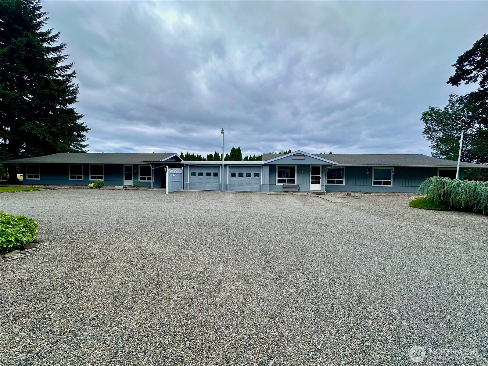 Turnkey income-producing duplex located on a quiet road in Centralia, WA. Each well-maintained, single-story unit features 2 bedrooms, 2 bathrooms, updated windows, and includes all appliances. Independent septic systems and a partially fenced backyard add convenience and privacy. Sitting on just under an acre with attractive landscaping, the property also boasts a spacious 30' x 48' shop with a 24' x 36' extension with two 14-foot doors, two 12-ft doors, and one 8-ft door—perfect for RV storage, hobbies, or a home-based business. Whether you're an investor looking for reliable cash flow or a buyer wanting to live in one unit and rent the other, this property offers flexibility, functionality, and lasting value in a peaceful setting.