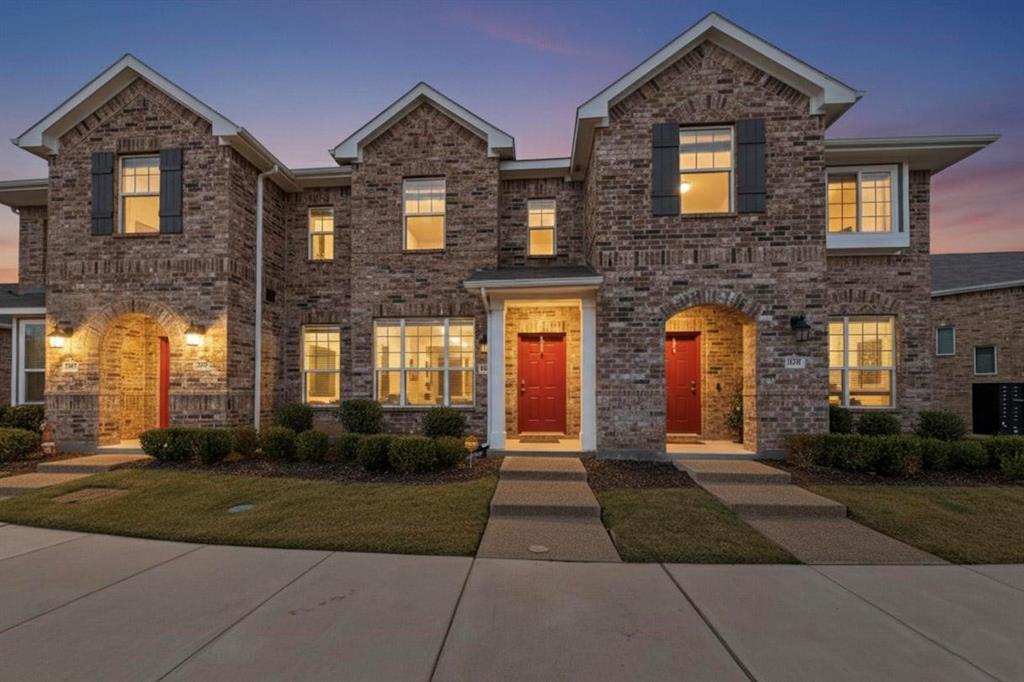 1287 Lamar Dr is a move in ready townhome is located in the Heritage Trail community in Lewisville, TX and is zoned to Lewisville ISD. Residents enjoy access to a community pool, park, playground, and walking paths. Ideally situated just minutes from I 35E, schools, shopping, dining, and everyday conveniences, the location delivers both comfort and accessibility.  The home features three bedrooms and two and a half bathrooms with an open concept main level. The living room flows seamlessly into the kitchen, which includes a breakfast bar and pantry, making it perfect for everyday living and entertaining. Upstairs, all bedrooms are located on the upper level along with two full bathrooms. The primary suite offers dual sinks, a spacious closet, and a separate shower. A rear entry, drive under garage adds convenience and functionality. Schedule a tour today and do not miss the opportunity to make this home yours. Discounted rate options and no lender fee future refinancing may be available for qualified buyers of this home.