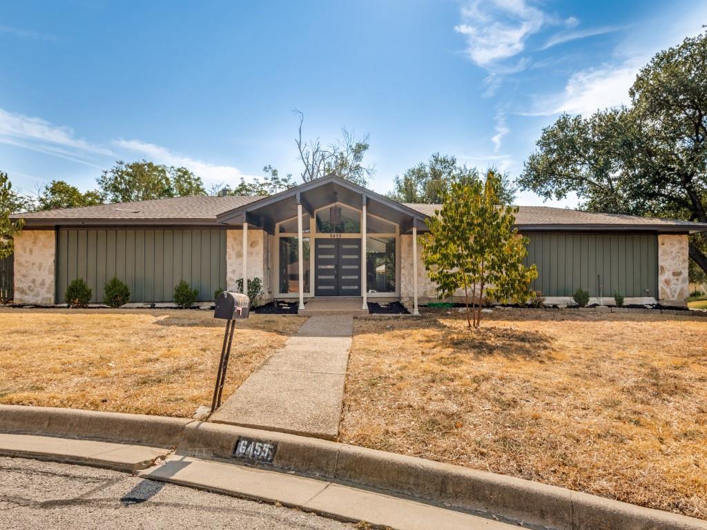 Beautifully updated Fort Worth home tucked away on a quiet cul-de-sac and offering the perfect combination of modern finishes and distinctive architectural character! Step inside to a spacious living area featuring soaring vaulted ceilings, exposed wood beams, abundant natural light, and a striking floor-to-ceiling stone fireplace. The updated kitchen is a standout with white cabinetry, quartz countertops, stainless steel appliances, subway tile backsplash, a large center island, stylish fixtures, and a barn-door pantry. Fresh neutral finishes and wood-look flooring flow throughout the home, while the bedrooms offer comfortable living space and plenty of natural light. The updated bathroom features a double vanity and large walk-in shower. Outside, enjoy a spacious fenced backyard with mature trees and a large covered patio—perfect for relaxing or entertaining. The home's stone accents, dramatic entry, and contemporary double front doors add unique curb appeal. Move-in ready, beautifully updated, and full of character!