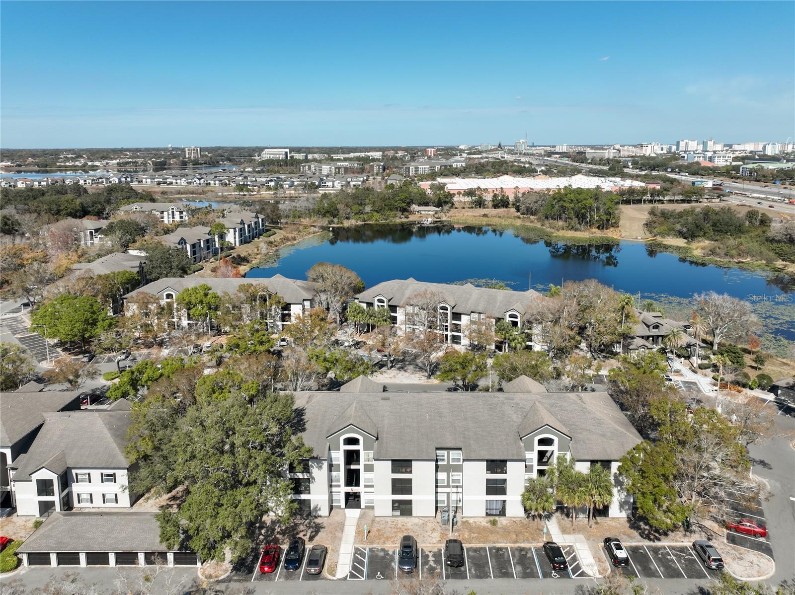 Fantastic two-bedroom, two-bath condo located in the heart of Dr. Phillips! Situated within the gated community of Sand Lake Private Residences, this condo offers a peaceful, private setting while remaining close to Orlando’s best dining, shopping, and entertainment. Inside, you’ll find a functional split floor plan with thoughtfully designed living space. Each generously sized bedroom features its own full bathroom and walk-in closet, providing both privacy and comfort. The open-concept living and dining area flows seamlessly to a screened-in lanai with water view. Additional features include an indoor laundry room, updated vinyl flooring throughout, fresh interior paint, updated fixtures, and additional storage closet off the balcony for added convenience. The community offers many amenities, including two lakefront pools, fitness center, tennis, basketball, and volleyball courts, a playground, dog-friendly walking areas, picnic tables, barbecue stations, and on-site management. Residents also enjoy access to a private dock on Sand Lake, perfect for peaceful views, fishing, or to watch nightly Disney fireworks. The community’s location is just minutes away from major highways, Restaurant Row, Universal Studios, Disney, SeaWorld, O-Town West, Mall at Millenia, International Drive, and more. HOA includes water, sewer, and trash. This is the perfect opportunity and location for buyer looking to use as a residence, or as a second home near attractions. Call to set up a private viewing today!