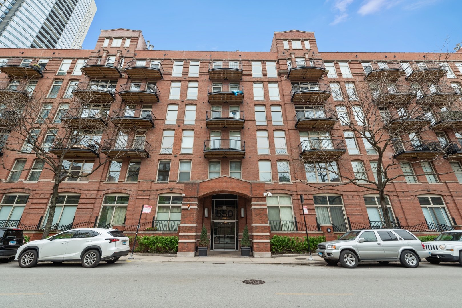 Gorgeous 1000sf true Chicago loft with exposed brick and beautiful timber ceiling - 1 bedroom plus den at Riverbank Lofts.  This meticulously maintained unit features an updated kitchen with stainless steel appliances, gas fireplace, and hardwood floors throughout. Enjoy the city view from your private, east facing balcony off of the family room. In-unit washer/dryer and enormous private climate controlled 18x11 storage room across from the unit. Building includes 24 hour door staff, rooftop deck, fitness center and dry cleaner. Conveniently located near the Riverwalk, East Bank Club, fantastic dining and shopping options with easy access to public transportation and the highway.