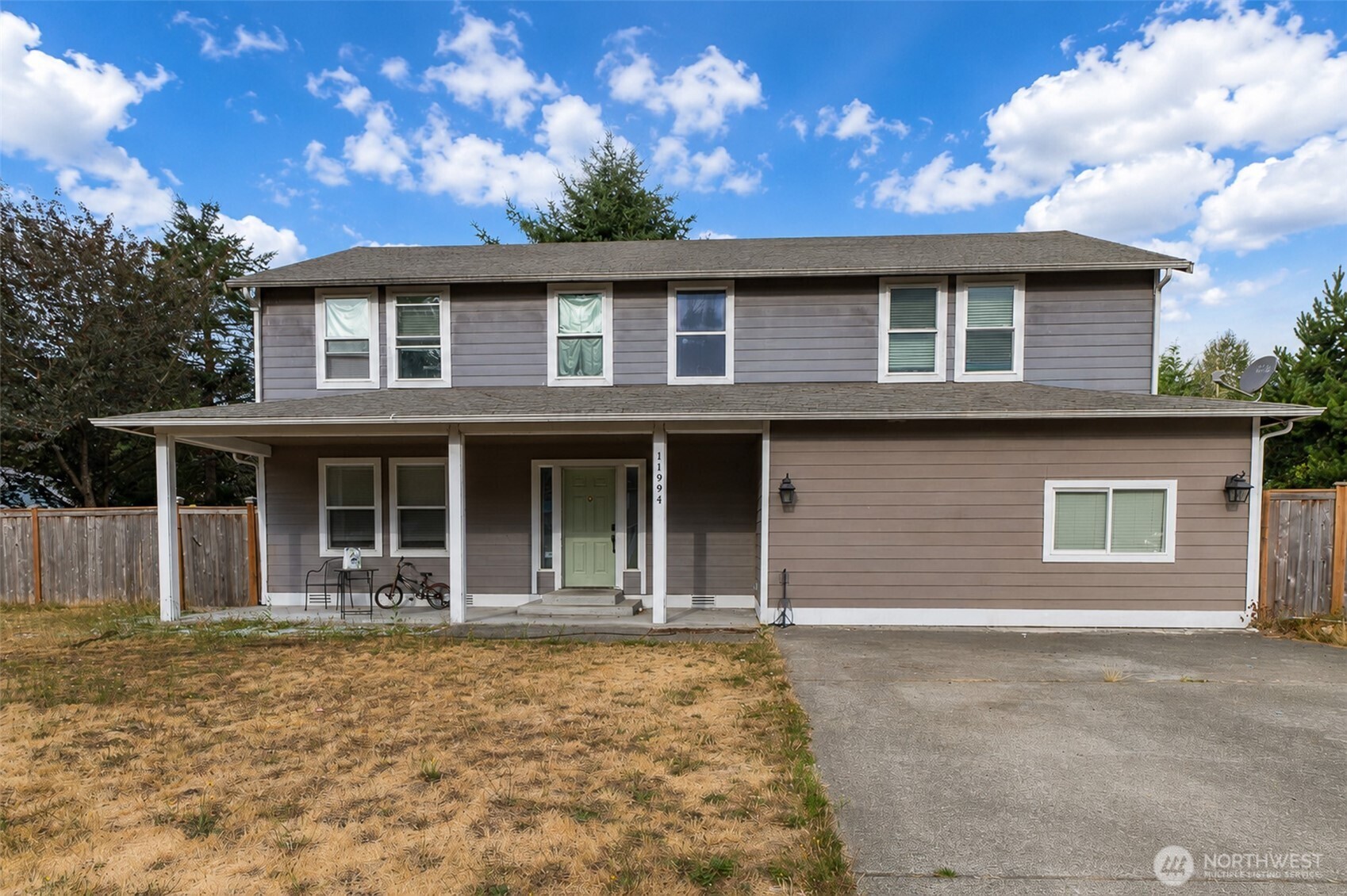 Comfortable 4-bedroom, 3.5-bath home with 2420 sq. ft. on .310 acres. It features a fully fenced backyard, a large shed, and updated stainless steel appliances. Functional layout with generous living spaces.