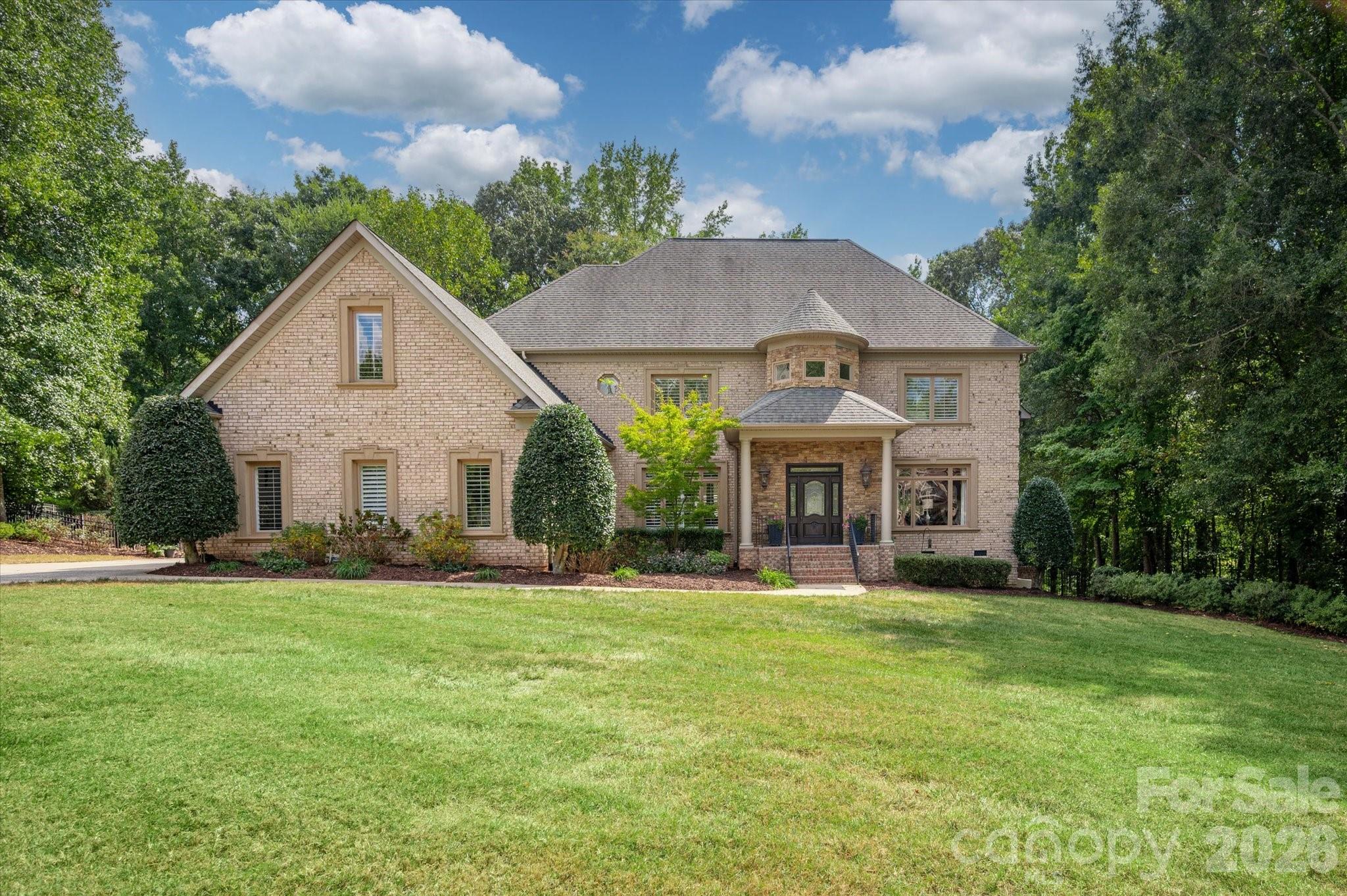 Exceptional golf course estate in sought-after Firethorne, ideally positioned along the 4th hole between the tee boxes and just a short walk to the club. This spacious 4-bedroom, 4.5-bath home offers a bright, open floor plan with beautiful hardwood floors, a dramatic curved staircase, two-story foyer, formal dining room, private study, and soaring two-story breakfast room. The gourmet kitchen offers abundant counter space and bar seating and opens to the keeping room with fireplace. A second fireplace anchors the main living room.The impressive primary suite is a true retreat with a sitting area, two custom walk-in closets, a beautifully renovated primary bath, and direct access to a private second-story terrace overlooking the property. Multiple outdoor living spaces take advantage of the picturesque setting, including a large back porch and covered rear porch overlooking a grassy green space, with a wooded backdrop providing privacy closer to the home. An outdoor full bath is conveniently located off the porch and the backyard is fenced.Additional highlights include new carpet, tankless water heater spacious laundry room with dedicated workspace and a 3-car side-load garage. A wonderful opportunity to enjoy golf course living, generous indoor and outdoor spaces, and the Country Club of the Carolinas lifestyle.