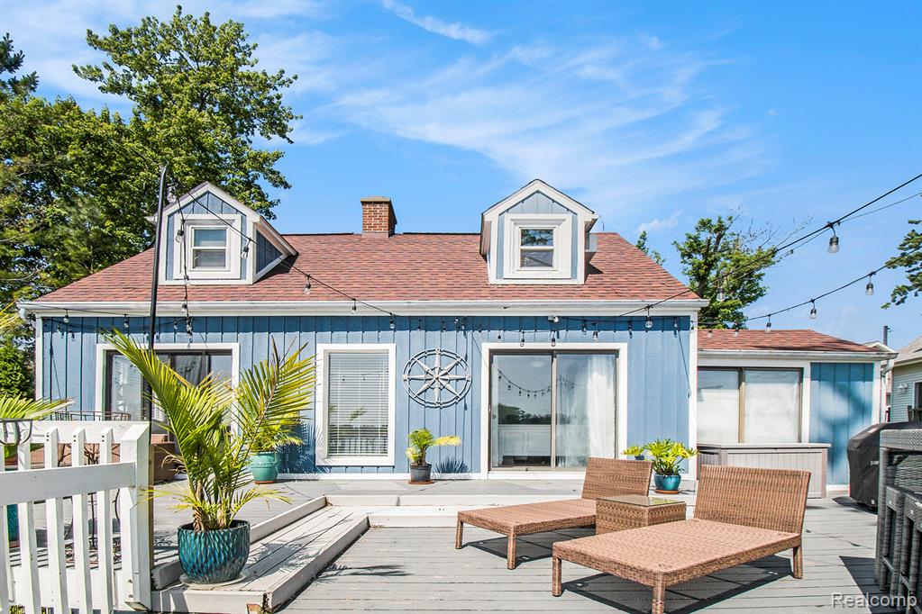Enjoy lakefront living on sought-after all-sports Lake Fenton with this spacious and updated Cape Cod-style home offering 40 feet of private lake frontage. With over 2,600 square feet, this 3-bedroom, 2-bath waterfront home blends classic character with modern updates and the kind of setting that makes every day feel like a vacation. The main level features new luxury vinyl plank flooring and fresh paint (2021), creating a bright, refreshed interior. Natural light pours in through large windows and multiple skylights, highlighting the beautifully updated kitchen with stainless steel appliances and solid surface counters. The living room, anchored by a fireplace, offers serene views of the lake and easy access to the deck—perfect for entertaining or soaking in the waterfront setting. The upper-level bonus room above the garage is nicely finished, ideal for a home office, guest suite, or hobby space. A partially finished walkout basement includes a cozy fireplace and offers even more potential for living or entertaining-use as a 4th bedroom if needed! Additional improvements include an updated main floor bath (2022), a new well tank (2022), and new garage doors (2023). Outdoor features include a lakeside fire pit on your private beach, a spacious deck, and plenty of room to enjoy the water year-round. This home offers the rare combination of space, updates, and direct access to one of the area’s premier lakes—ideal for boating, swimming, or simply relaxing by the water.