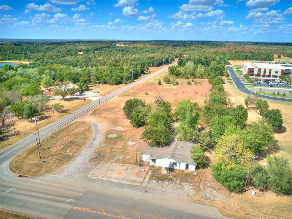 PRIME 4.9-ACRE COMMERCIAL LAND NEAR LAKE THUNDERBIRD – ZONED TOURIST COMMERCIALExceptional development opportunity in East Norman! Situated along high-traffic Little Axe Drive, this expansive 4.9-acre parcel offers endless potential for business owners, developers, and commercial investors. Located just 1.4 miles from the Little Axe Boat Ramp and Lake Thunderbird State Park, the property sits directly in the path of steady daily traffic from local residents, commuters, and thousands of annual recreational visitors.Zoned TC (Tourist Commercial) by the City of Norman, this rare designation allows for a wide variety of high-demand, high-return commercial uses. With limited commercial-zoned inventory in the immediate trade area, this property is ideally positioned to fill a major market void.Permitted & High-Potential Uses Include:• Boat, RV, & Vehicle Storage (High local demand near the lake!)• Convenience Store / Fuel Station• Quick-Service Restaurants (QSR) & Dining• Bait, Tackle, & Outdoor Outfitter Shops• Neighborhood Retail & Service Commercial• Hospitality / Lodging ConceptsKey Features & Highlights:• Generous Parcel Size: 4.9 Acres providing flexible site layout, ample parking, and deep setback capability.• Unbeatable Location: Minutes from boat launch facilities, camping grounds, and lake amenities.• High Visibility: Excellent frontage along Little Axe Dr with over 17,000 daily vehicle counts.• Strong Local Demographics: Serves an expanding trade area with strong median household incomes exceeding $85,000 within a 5-mile radius.Whether you are looking to build a high-cap-rate boat/RV storage facility, launch a retail development, or land-bank in a growing commercial corridor, 15821 Little Axe Dr offers the perfect location, zoning, and size to bring your vision to life. Properties with TC zoning this close to Lake Thunderbird rarely hit the market—don't miss out on this turnkey development site!