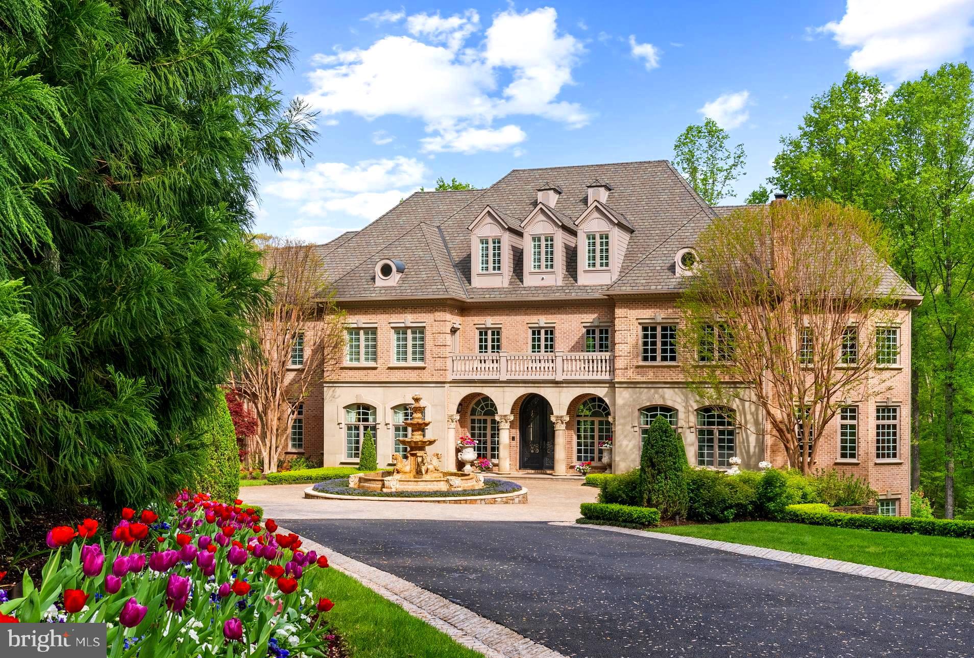 THE ESTATE AT MINE RUN:Nestled in  the blissful hills surrounding Great Falls Park is a masterpiece of old-world craftsmanship and modern appointments. Encompassing approximately 5.44 acres of secured land; this estate affords a unique combination of privacy and accessibility.  Passing through the stately front gates is a breathtaking tree canopied sweeping driveway which culminates at the main residence with its commanding motor court and majestic fountain. The spectacular grounds feature lush specimen plantings, stunning hardscape, antique sculptures, Haddonstone garden gazebo, fountains and so much more!  The handsome facade showcases lovely arches and ornate precast columns. Step into the breathtaking foyer, where your greeted by stunning Swarovski crystal chandeliers in every room, with gleaming marble floors and soaring ceilings setting a tone of timeless grandeur. Stunning plaster moldings with gold appointments and bespoke millwork flow from the foyer seamlessly into the living, dining and great room creating an elegant continuity throughout.  The formal living room-bathed in natural light from Palladian windows overlooking the lush grounds exudes warmth and sophistication.  French doors open to the music room and conservatory/sunroom, ensuring effortless flow for both grand entertaining and intimate gatherings. The library features lovely hardwood floors with inlay  cherry borders, custom built-in cabinetry and custom shutters.  A spectacular gourmet kitchen- well appointed with crystal chandeliers, Viking range, Sub Zero and extra large kitchen islands with intricate millwork, custom cabinets and countertops,  wine/beverage refrigerators, specialty tile backsplash, generous breakfast room with fireplace and floor to ceiling windows and french doors opening to the terrace.  Primary Suite - is a sanctuary of refinement featuring 23 carat  gold leaf ceilings, angled hardwood floors, tray ceilings and a sitting room warmed by a glass-enclosed fireplace all overlooking the stunning grounds. Crystal sconces and detailed plaster moldings accentuate soaring ceilings, blending grandeur with intimacy. Primary Bath- spa-inspired retreat with 20 “  marble floors, marble vanities adorned with Mother-of-Pearl inlays and  intricate gold inlay  and imported Italian tile with custom solid brass fixtures. Indulge in a spa shower with body sprays or unwind in the tub - an indulgent oasis of relaxationThe walk-out lower level crafted for unforgettable gatherings features a billiards area with custom sconces and recessed lighting, a top of the line golf simulator, fireplace and a state-of-the-art theater with paneled walls and a home gym/work out room.   A full kitchen with granite counters and large breakfast bar ensures seamless hosting. A spacious recreation room with expansive windows and a playroom/bedroom with a full bath offer versatility.  Large floor to ceiling  custom doors walkout to covered terraces which are all framed by scenic views.  Tucked discreetly on the estate’s grounds is a fully appointed guest cottage offering a private retreat for guests, staff or security detail. Featuring 2 BRs, 2 BAs, hardwood floors, 2 cozy fireplaces, a full kitchen, covered screened porch and an extensive climate controlled wine cellar;  providing independent comfort and privacy. Fully fenced compound, Luscious gardens, terraces, deck, fountains. granite block paver motor court, generators for both homes, state-of-the-art security, irrigation system  complete this amazing offering.  Equestrian in the family? Many facilities in the area! (See map in documents) All within 25 minutes of Dulles & Reagan National airports - Langley High School pyramid-Registration form needs to be provided with showing request.  Thank you! Must watch video-https://youtu.be/ulEHmGRrcbA?si=yraOjq8WQBUVlzi7