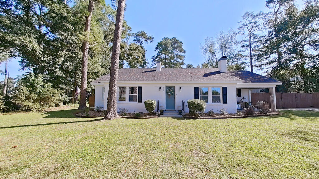 Adorable Remodeled Cottage in the Heart of Town! Conveniently located near schools and within walking distance to parks, this charming home has been beautifully remodeled with stunning finishes throughout. Enjoy gorgeous hardwood floors, a freshly painted interior, a spacious living area with a beautiful brick hearth, and a separate dining room perfect for entertaining. The adorable kitchen offers excellent cabinet space and stainless-steel appliances. Featuring 3 bedrooms and 2 beautifully updated baths, this home includes a remodeled primary suite with hard-surface countertops, a spacious vanity with great storage, and a gorgeous new tile shower. Two additional spacious bedrooms feature hardwood floors and fresh paint. A convenient hallway laundry area includes a stackable washer and dryer. Outdoor living is just as inviting, with a covered front porch featuring a sunshade, an open back patio, and a beautiful backyard with plenty of room to relax or entertain. This delightful cottage is centrally located and close to everything you need. You have to see this one—it's just as cute as can be and ready to welcome you home!