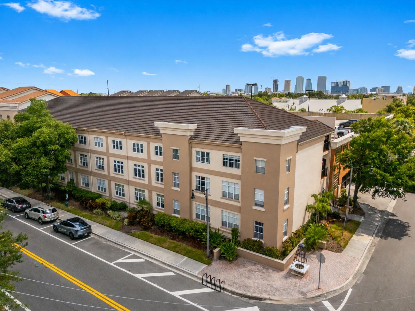 SOHO Living in the Heart of South Tampa!Welcome home to our beautifully renovated 2-Bed, 2-Bath unit featuring High-End Finishes and exceptional convenience in a private, Secured-Access Building. This ALL-Ages, PET-Friendly Community offers a welcoming environment, Two dedicated Parking Spaces, and an IN-Unit Washer and Dryer. The thoughtfully designed Open Floor Plan provides an effortless flow between the Living, Dining, and Kitchen areas, making this home well-suited for everyday living or entertaining guests. The desirable DUAL-Primary Suites provide exceptional privacy, each with a WALK-IN Closet and Renovated Baths, featuring Contemporary Fixtures, Custom Inserts, and a sophisticated, Spa-Inspired Atmosphere. The fully remodeled Gourmet Kitchen is the true centerpiece of this unit, showcasing High-End Appliances, Contemporary Cabinetry, elegant CORIAN Counter-tops, and a Custom Built-in Mini Bar complete with a Wine Cooler. Designed with entertaining in mind, the kitchen opens seamlessly to the living area, creating an elegant yet functional space for both everyday living and hosting guests.  Additional improvements include a tankless water heater and updated HVAC, providing added efficiency and peace of mind. With secure building access, two garage parking spaces, in-unit laundry, dual primary suites, and extensive high-end renovations, this exceptional residence offers a turnkey opportunity for those seeking stylish, low-maintenance living in the Heart of Tampa. Call today to schedule your showing