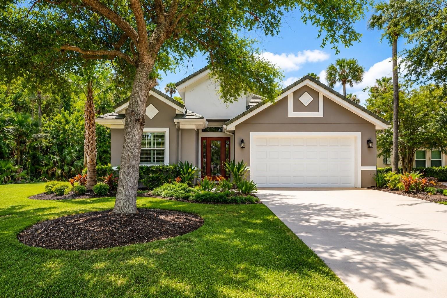 Virtually Staged. Price Improved! Experience the perfect blend of comfort, style, and privacy in this exceptional 2022-built home located in the sought-after gated community of Tidelands on the Intracoastal. Offering 4 spacious bedrooms, 2 beautifully appointed baths, and over 2,200 square feet of thoughtfully designed living space, this home is truly move-in ready.From the moment you enter, you'll appreciate the soaring coffered ceilings, elegant crown molding, abundant natural light, and open-concept floor plan designed for both everyday living and effortless entertaining. The gourmet kitchen features stunning marble countertops, stainless steel appliances, ample cabinetry, and a large island overlooking the living and dining areas.The private owner's suite offers a peaceful retreat with custom closet systems and a beautifully appointed en-suite bath. Hurricane-impact windows, a tile roof, reverse osmosis water filtration system, and a finished garage floor provide comfort, quality, and peace of mind.Step outside to your screened lanai where tranquil wooded views create a serene backdrop with no rear neighbors—the perfect place to enjoy your morning coffee or unwind at the end of the day.Living in Tidelands means enjoying an exceptional Florida lifestyle with two resort-style pools, a fitness center, clubhouse, tennis, pickleball, and basketball courts, scenic walking and biking trails, Intracoastal fishing piers, private day docks, and beautifully maintained grounds—all just minutes from Palm Coast's beaches, golf courses, boating, shopping, dining, and medical facilities.Why wait to build when you can enjoy a like-new home with upgrades already completed and immediate access to one of Palm Coast's premier waterfront communities? This is more than a home—it's the Florida lifestyle you've been waiting for.