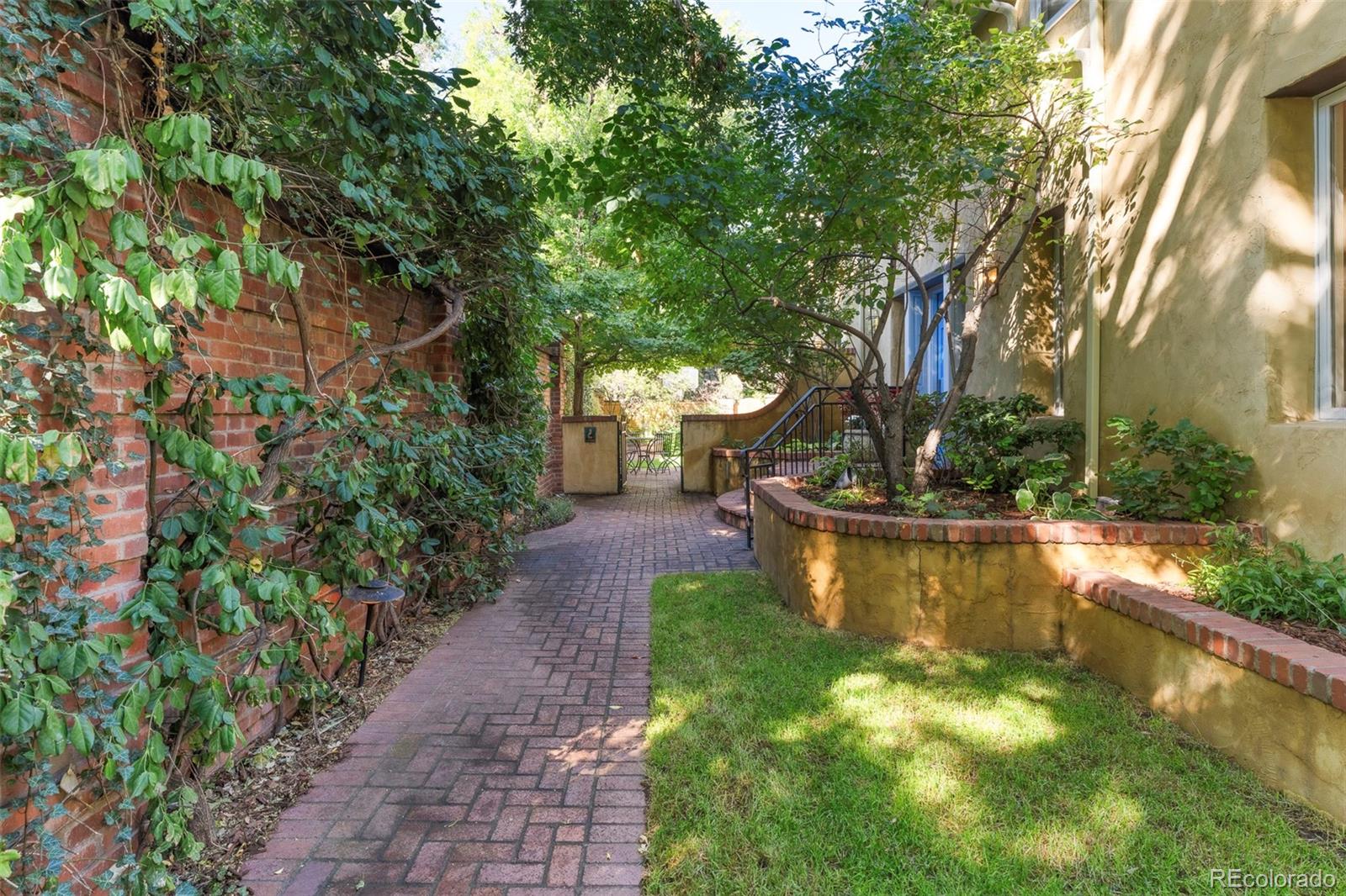 Charming European-style two-story home in the heart of South Country Club / North Wash Park neighborhood. Set on an oversized 6,230 sq ft lot, this 4-bedroom, 5-bath home offers inviting, oversized rooms with incredible south facing natural light. The lot is exceptional surrounded by lush, mature landscaping and private brick patios. The main home features a spacious primary suite with a large en-suite bath, plus two additional upper bedrooms that share a full hallway bathroom—a highly sought-after layout. A fourth bedroom, located at the back of the home, offers incredible flexibility as a guest suite, home office, or studio, complete with its own attached bathroom, large closet, vaulted ceilings, and abundant natural light. The charming exterior and thoughtful floor plan provide an ideal blend of comfort, character, and opportunity for personalization. Additional highlights include an attached two-car garage plus two off-street parking spaces, large, finished basement with additional full bath and egress window, and beautifully mature trees that create a sense of privacy and calm. Located in one of Denver’s most coveted neighborhoods—just minutes to Washington Park, Cherry Creek, and minutes to downtown—this home offers timeless appeal and endless potential.