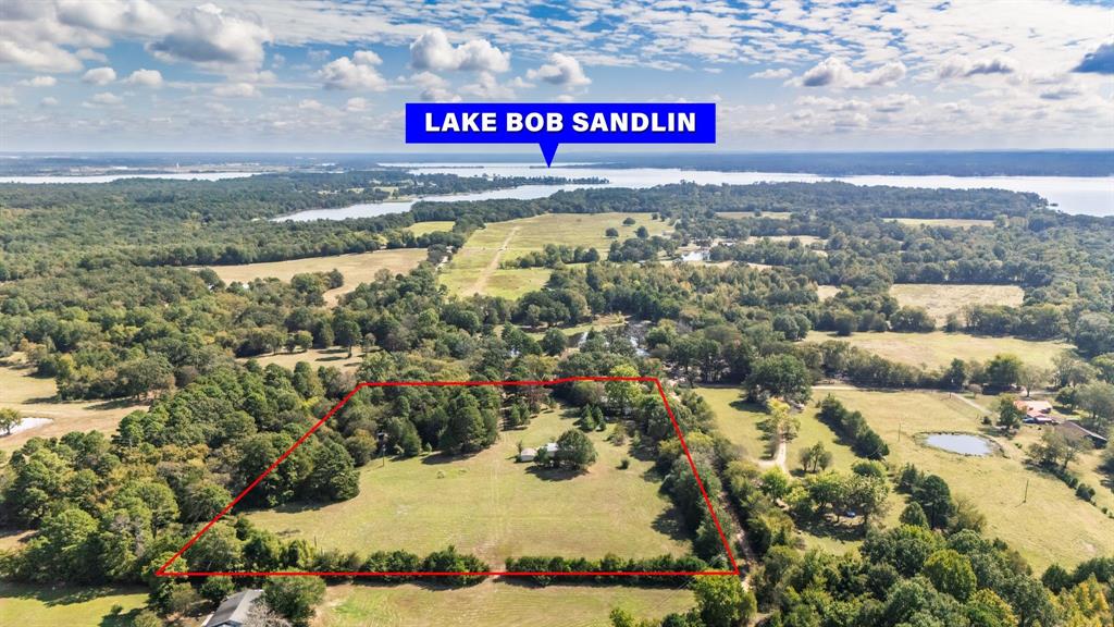 Looking for space, privacy, and flexibility near Lake Bob Sandlin? This 9.308-acre property near Mt. Vernon, TX offers just that—with two homes already in place! The main home is a classic 3 bed, 1.5 bath brick house built in 1966. It includes a fireplace, updates, full of character, and ready for your personal touch. The second home is a 2 bed, 2 bath manufactured home with open floor plan—ideal for extended family, guests, or rental income.The land is a beautiful mix of open pasture and mature trees, perfect for gardening, animals, or just enjoying the peace and quiet. There's even a small pond tucked in the woods, adding to the property's charm. Located in Mt. Pleasant ISD, you're 5 minutes to Lake Bob Sandlin State Park, 7 minutes to a public boat ramp at Lake Bob Sandlin, and minutes from Lake Cypress Springs—making this spot ideal for nature lovers, weekenders, or full-time living.You can live in one house and use the other for rental income, or rent out both, or use as a B-n-B. Whether you're dreaming of a homestead, a family compound, or an investment property, this one has the space and potential to make it happen.