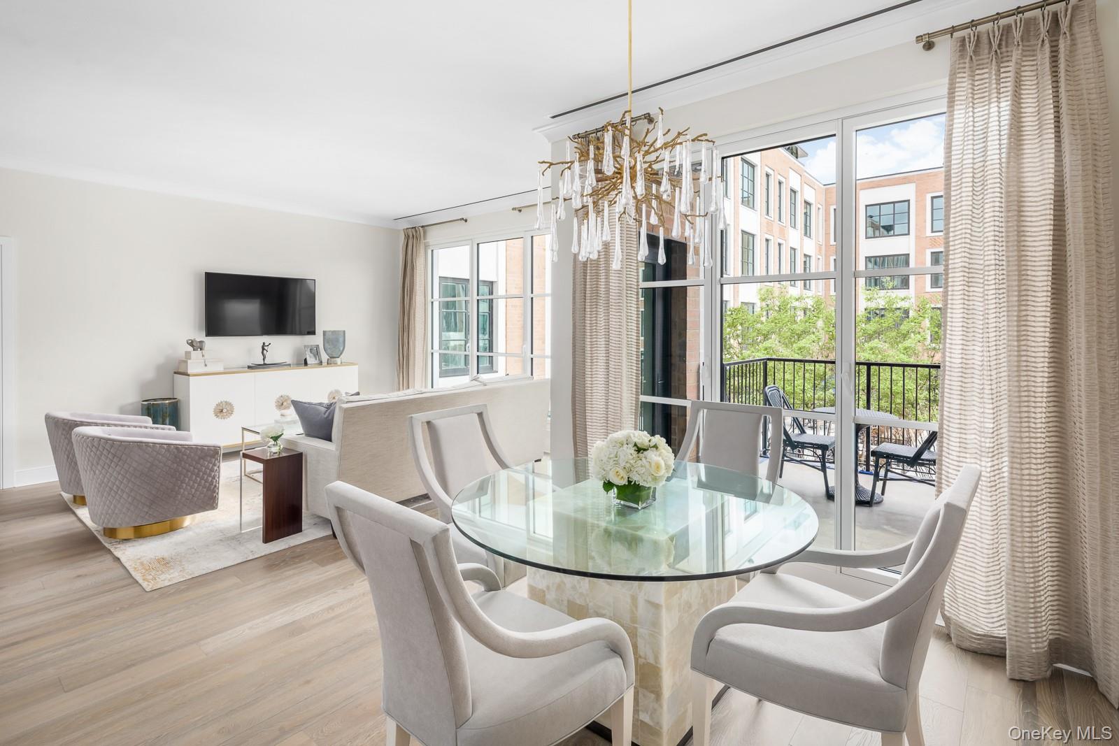 GLEN COVE -This bright two bedroom, two bathroom home features 10' ceilings, and floor to ceiling windows. This layout features an open kitchen with views of the pool and marina. The gourmet kitchen complete with custom paneled GE appliances has white Brazilian quartzite countertops and a kitchen island with a Kohler undermount sink, Insinkerator garbage disposal and instant filtered hot and cold water faucet. A GE Monogram 6 burner gas range is equipped with dual infrared cooking and is fully vented. The white Siena flat paneled cabinets and a Sharp easy touch drawer style microwave complete the space. The spacious primary bedroom features a large closet and an en-suite 4-fixture primary bathroom with white marble floors, countertops and full height porcelain tiled walls, a glass enclosed shower and a double vanity with all Kohler fixtures. The home includes a front loading washer and dryer. The Beacon at Garvies Point is perfectly situated in North Shore's most dynamic new community, set in a 56-acre picturesque waterfront and adjacent to a 62-acre serene nature preserve, within 1 hour of Manhattan. Exclusive residential services & amenities feature a 24-hour concierge, outdoor kitchens, outdoor pool, state-of-the-art fitness center, yoga studio, library, lounge, card room, game room, dining/party room with prep kitchen and a 32 person screening room. Great opportunity for an investor!! Available with tenant in place until November 2026.