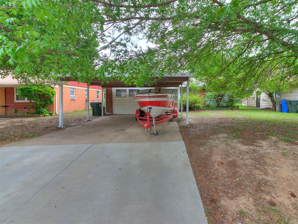 Move-in ready mid-century home located on N Berry in one of West Norman’s favorite established neighborhoods, Woodslawn. You’ll enjoy great access to N Robinson, University Town Center, Downtown Norman, and the University of Oklahoma. This 3-bedroom, 1 full bath and 1 half bath home features a rare open floor plan for the area, original parquet hardwood floors, and painted cabinetry with a clean modern gray and white color scheme. It offers the perfect blend of retained mid-century charm and modern convenience, including an interior laundry room and ceiling fans. The kitchen provides ample workspace with laminate countertops, dishwasher, and freestanding electric stove with oven, plus an eat-in dining area. Two bedrooms are located on the same side of the home and one bedroom is on the opposite side. Outside, you’ll love the very nice screened-in covered back porch, perfect for relaxing while overlooking a spacious backyard. There’s covered parking for 2 cars. Additional highlights include a large front yard and mature trees. Property to be sold As-Is.
