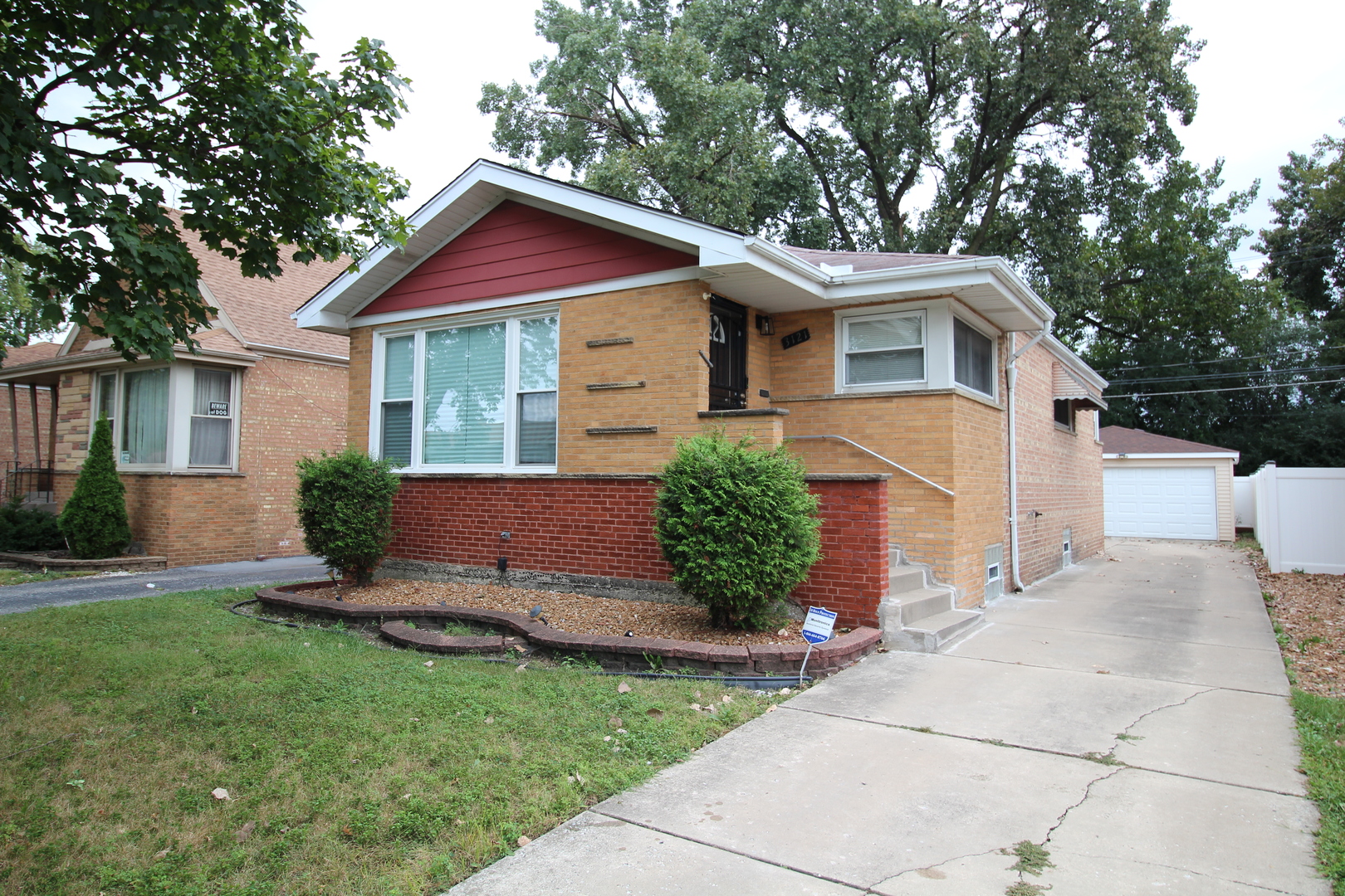 Welcome to this spacious 4-bedroom, 2-bath home. This home offers plenty of room. Hardwood floors were recently refinished and home was painted throughout as well.  Kitchen features stainless steel appliances and modern finishes. Home is move-in-ready. The finished basement provides valuable additional living space with endless possibilities for a family room, recreation area, home office, or entertaining. 4th Bedroom in the basement with a full bathroom. Home has over head sewers.  This home offers the space and versatility you've been looking for. Nice long driveway that comes up to a 2 car garage with no alley.  Home has a deck on the exterior part for hanging out with family and friends.  Schedule your showing today!
