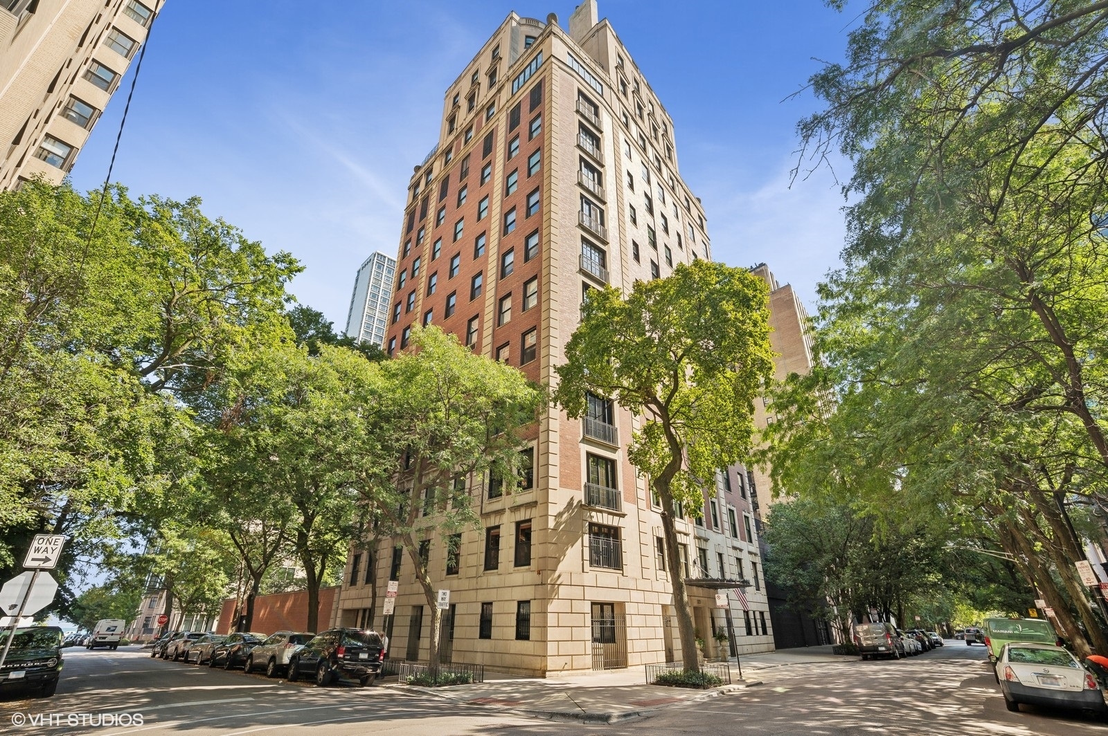A truly exquisite vintage home on one of the most coveted streets in Chicago. This immaculate Gold Coast condo lives like a single family home with approximately 4300 sf of living space all on one level and beautiful tree-top views from every window. Featuring 3 bedrooms and 4 full bathrooms, this home has kept all of its vintage charm with crown molding & hardwood floors throughout, ornate millwork, custom built-ins, a wood burning fireplace & antique mantles. Enter the home through a private elevator bank and step into the grand foyer. Chef's kitchen features shaker cabinets, custom hood, high-end stainless steel appliances, island with seating, separate breakfast nook, dry bar with beverage fridge & a stunning tray ceiling. Continuing on, you will find the formal dining room, perfect for hosting gatherings, followed by the expansive formal living area with stunning vintage details and ample room for seating & entertaining. The more intimate family room is just around the corner surrounded by beautiful built-ins and an attached wet bar. All 3 bedrooms are generously sized and offer ensuite bathrooms. The primary bedroom features a luxurious bathroom with double vanity, walk-in rain shower, separate soaking tub & ample storage. A separate private office, full bathroom & massive laundry/mud room off the kitchen round out this spectacular home. Pet friendly and conveniently located on a premier quiet tree-lined street. Experience city living at its absolute finest in this highly sought-after building designed by renowned architect Andrew Rebori. Building amenities include 24-hour door staff, professional management, full-time engineer, in-unit package delivery, and two oversized storage rooms. Steps to Lake Michigan, the Lake Front Trail, Oak Street Beach, Goudy Park, Latin & Francis Parker schools, transportation, restaurants, cafes, nightlife and Magnificent Mile shopping. The neighborhood also offers convenient grocery stores, pharmacies and cleaners that all deliver. Ideal primary or in-town property. Indoor heated garage parking included.