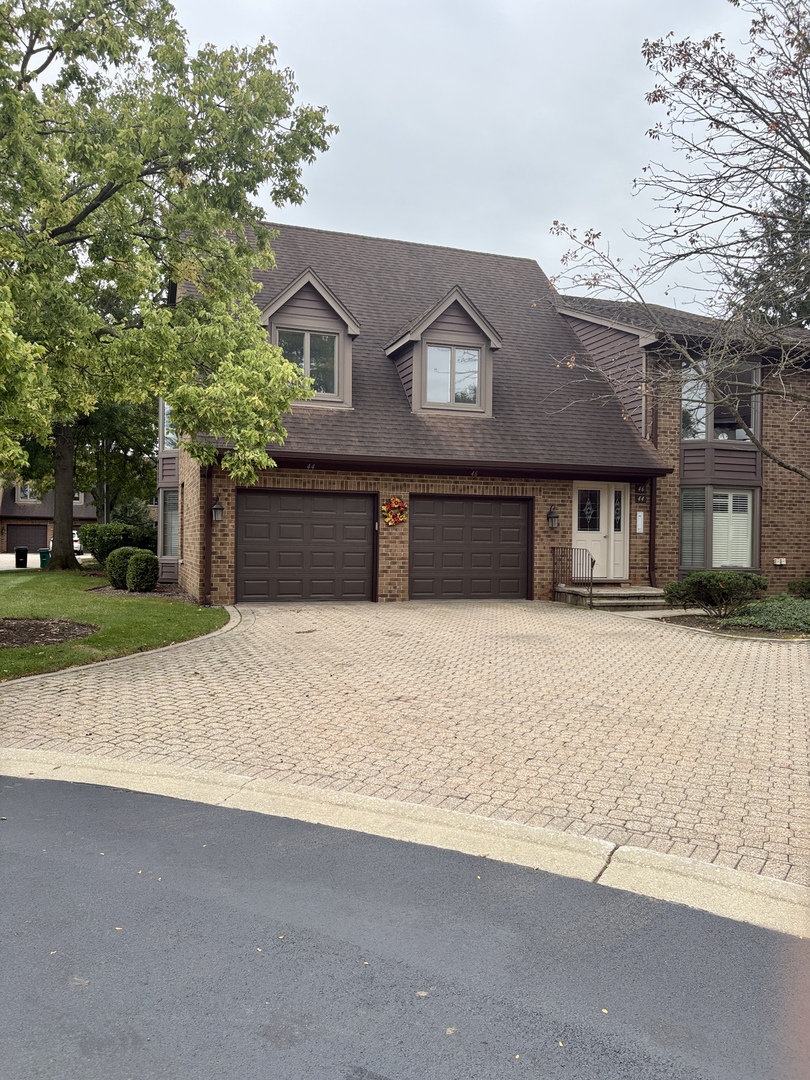 This super neat & clean, spacious, 2Br 2BTh, 1st floor Ranch model w/attached garage has been impeccably maintained, freshly painted, and is in the sought after Courtyards of Westchester. New carpet and neutral decor provide a warm, comfortable feeling throughout and the convenient floor plan makes living easy. The large kitchen w/EAS is right off the garage, is fully applianced, has a pantry, plus loads of solid wood cabinets. The living room has a cozy gas fireplace with a marble surround and a formal dining room area, perfect for special dinners and entertaining. SGD's off the DR lead to a private patio with mature landscaping. The huge Primary BR has a walk-in closet and private bath w/double sink and separate shower w/bench and grab bars conveniently in place. Guest BR has 2 custom built-in oak shelving cabinets, stylish wood blinds and a double closet. The mechanicals are updated with a high end Carrier HVAC & humidifier system, circuit breaker electric, and newer HWH as well. Full-size W/D in unit. The concrete crawl provides even more storage options and everything is in an incredibly accessible location to OB Mall, Mariano's, highways, WS metra train, forest preserves and more. Great as-is and/or easy to add updates and personal touches, you'll find a very desirable lifestyle here.