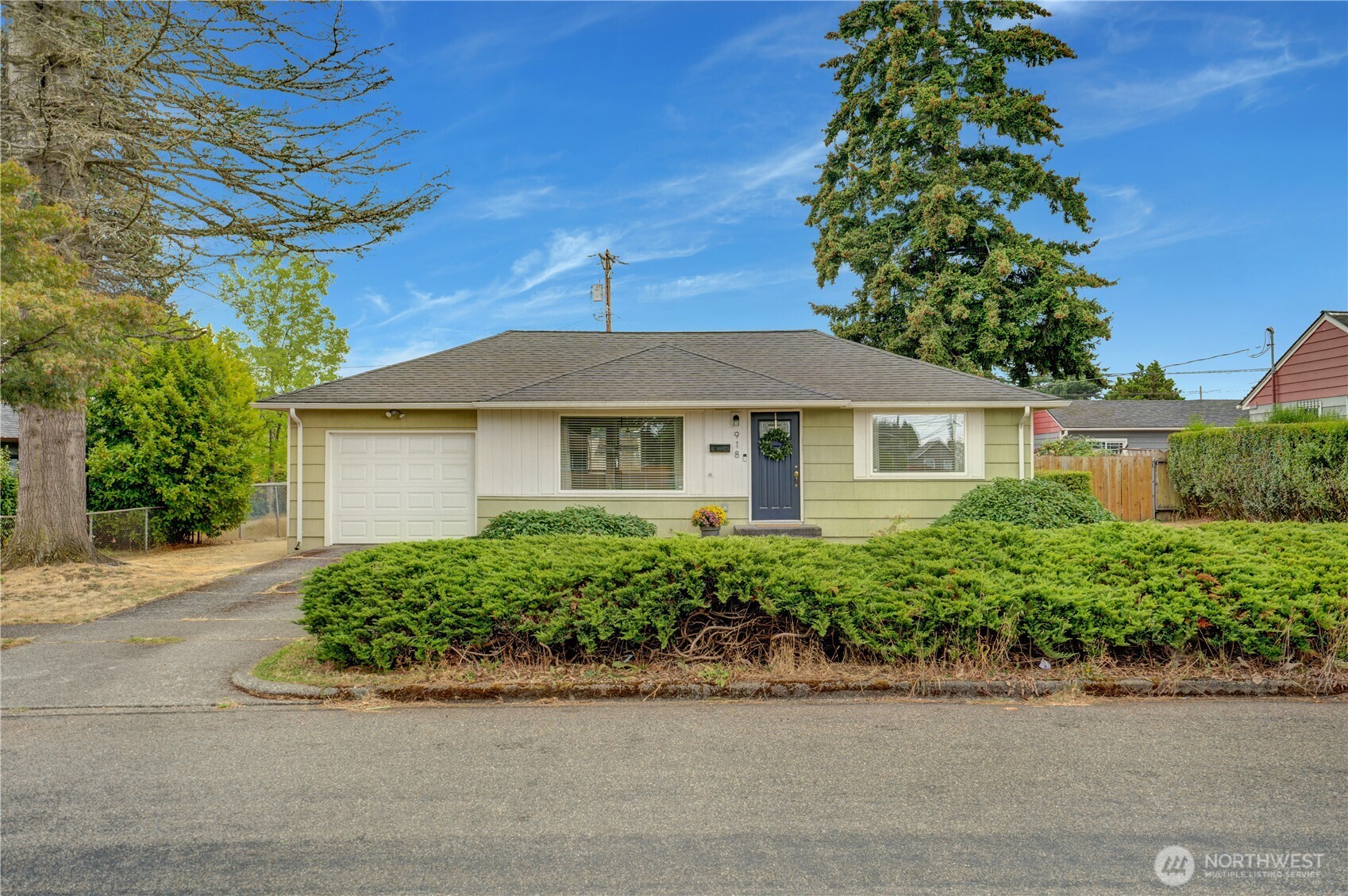 Cute, move-in ready, and easy to love! This rambler is a great place to build equity and put down roots of your own. Inside, you’ll find plenty of style with beautiful laminate flooring, updated windows and a kitchen with butcher block counters and an eat-in bar, plus room to add your own personal touches. The attached garage and tankless water heater add everyday convenience, while the huge, level backyard gives you plenty of room to enjoy life outside. Gather around the fire pit, hang out under the gazebo, garden, play or simply enjoy all that space. The home and sewer have already been pre-inspected for you. Plus, you’re close to local favorites like Top of Tacoma, Dusty’s Hideaway and Beware Coffee, along with the Lincoln District, Stewart Heights Park and Eastside Community Center. This is a smart home purchase to live, gather & grow while building something of your own.