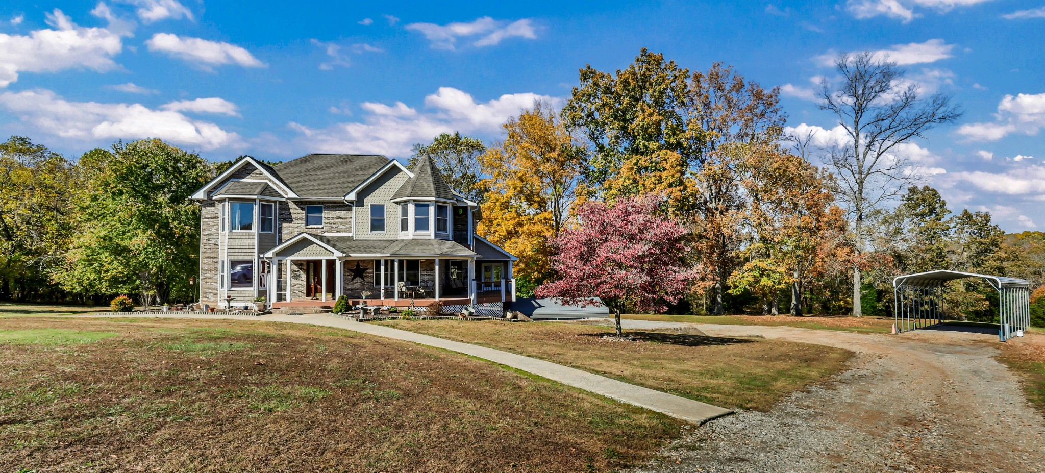 Welcome to 2753 Jarrell Ridge Rd — a breathtaking blend of modern elegance and country serenity on 50.33 rolling acres in Montgomery County. This custom-built estate showcases superior craftsmanship, refined finishes, and remarkable attention to detail. Offering approximately 4,120 sq ft of finished living space plus a full basement, the home features four spacious bedrooms, two full baths upstairs, and inviting main-level living areas enriched by hardwood floors, tile accents, and custom trimwork.

Every detail has been thoughtfully elevated for comfort and style. Dual HVAC systems ensure year-round climate control. A beautiful sunroom opens to Trex-surfaced decking and a covered back patio with tongue-and-groove pine ceilings, recessed lighting, and warm architectural character. The front porch, balcony, and trimwork were enhanced with PVC-wrapped woodwork, black metal spindles, and designer fixtures, while a new roof ties the exterior together in perfect harmony.

Inside, the chef’s kitchen impresses with dual ovens (gas and electric), a new dishwasher, sink, and microwave. Upstairs offers new carpet, two tiled bathrooms with laundry chutes, and a walk-up floored attic providing abundant storage.

Outdoors, the property is designed for those who appreciate space, functionality, and nature. It includes a four-stall horse barn, tack and tool sheds, a 26×20 equipment shed with electric and water, a 12×16 metal garden shed, and an 8×8 elevated hunting cabin with metal siding, sliding windows, and carpeted flooring. Concrete wash racks, gravel drives, and manicured surroundings reflect the pride of ownership found throughout.

A true Jarrell Ridge masterpiece — where luxury, comfort, and Tennessee’s natural beauty come together to create an extraordinary lifestyle.