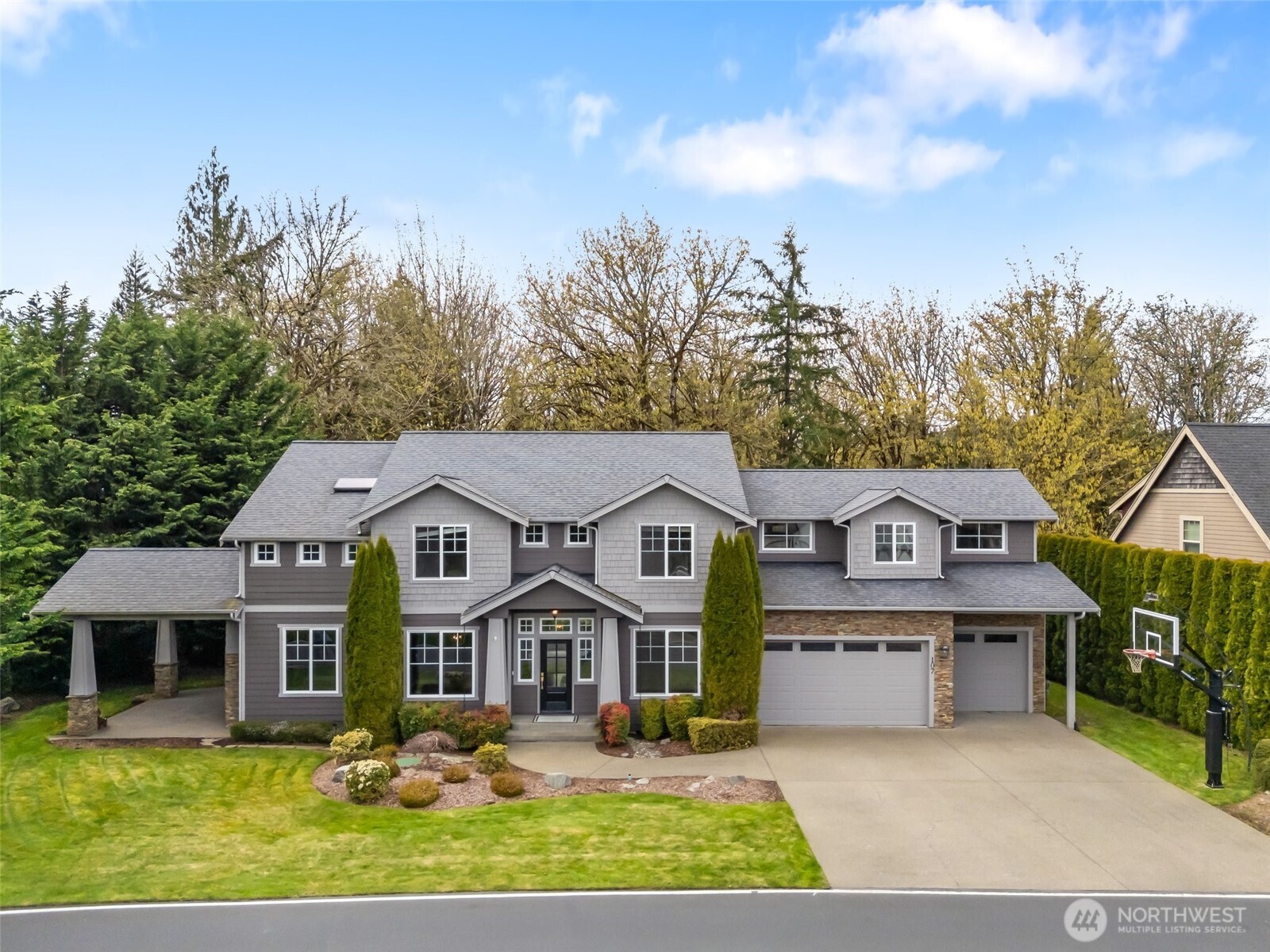 Welcome to this stunning home in gated Alderwood Heights—a true blend of design & craftsmanship. Featuring 3 beds, 2.5 baths, & maple hardwood floors throughout. The living room showcases stone accents & a cozy indoor/outdoor double-sided gas fireplace that also warms the covered patio. Step onto your private deck with forest views. The chef’s kitchen includes hickory cabinets, slab quartz counters, double ovens, gas stove, prep sink, & wine bar. The family room adds charm with a second stone-accented fireplace. Upstairs, a massive bonus room with wet bar offers endless options. The luxurious primary suite features dual walk-in closets, a spa-like bath with heated tile floors. Your dream home awaits—tour it today!