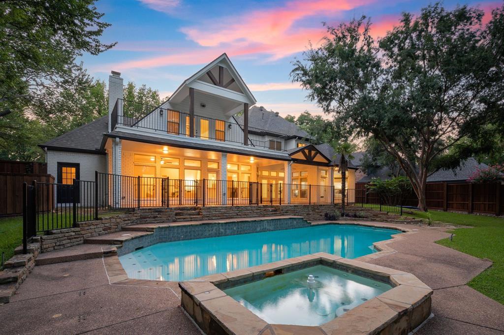 Welcome to this breathtakingly remodeled gem, perfectly nestled in the heart of Colleyville. This exquisite home offers 5 generously sized bedrooms, 6 full bathrooms, a private home office, and an expansive game room complete with a wet bar and its own full bath, ideal for entertaining or unwinding in style. From the moment you step inside, you're welcomed by a grand staircase, soaring ceilings, and warm hardwood floors that flow throughout. Designer lighting, rich architectural details, and walls of windows fill the home with natural light and elegance at every turn. The chef’s kitchen is both timeless and functional, featuring classic white cabinetry, a large island with seating, a walk-in pantry, and stainless-steel appliances, all seamlessly open to the living and dining areas, creating the perfect space to host and gather. The luxurious primary suite with automatic blinds is a true retreat, with a spa-inspired ensuite showcasing a freestanding soaking tub, dual vanities, sleek modern lighting, and a stunning walk-in shower. Step outside to your private backyard oasis with a sprawling covered patio and balcony, overlooking lush landscaping, and a sparkling heated pool and spa, the ideal backdrop for quiet evenings or lively gatherings. All of this, just steps away from Colleyville’s best schools, dining, and shopping. New roof 2024 & new pool equipment 2021.