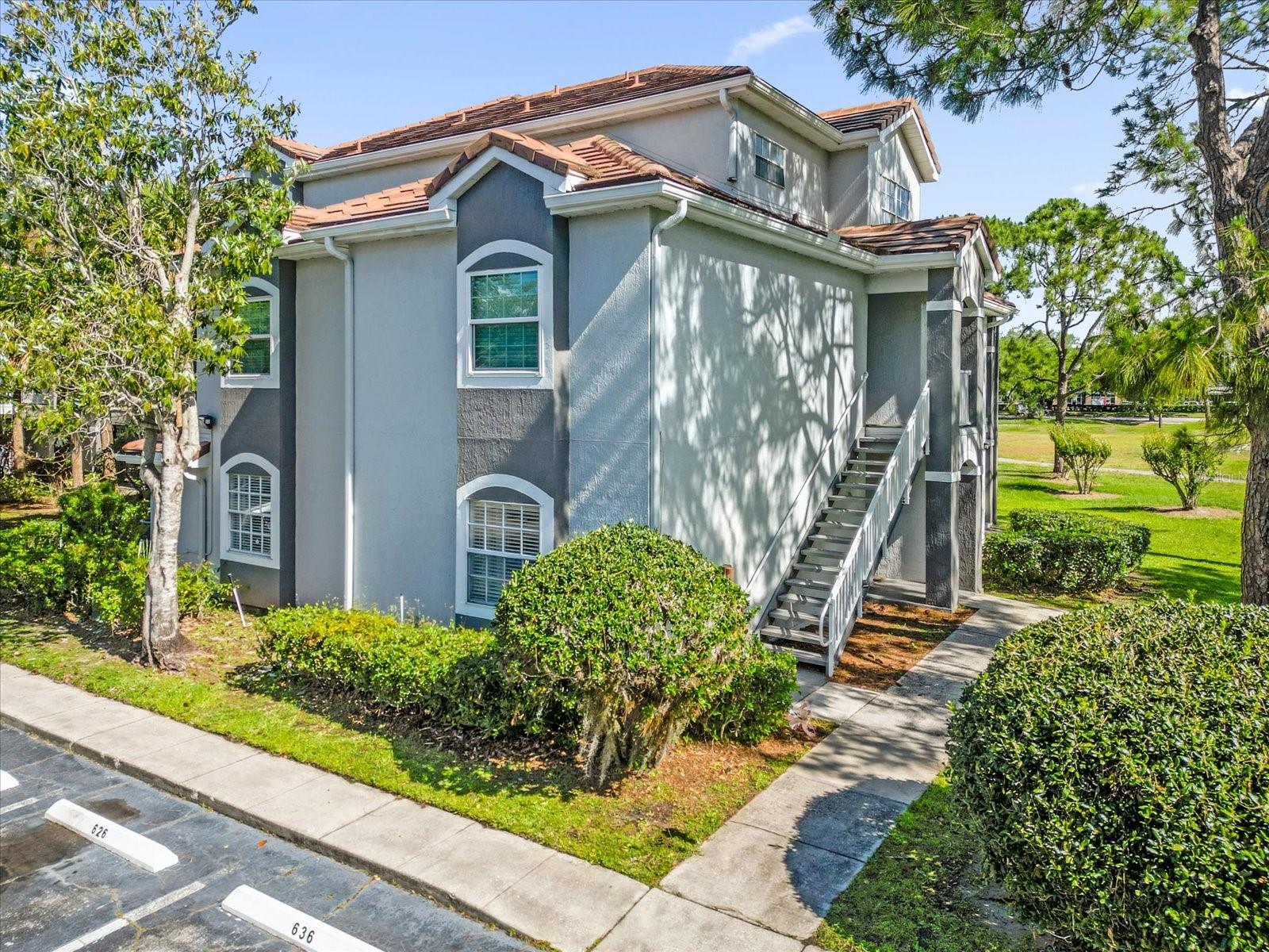 Located in the gated Audubon Villas community in Hunter's Creek, this 2-bedroom, 2-bath first-floor end-unit condo offers a private side entrance and a bright, open floor plan. The kitchen features black appliances, black countertops, and white cabinetry, along with ample storage. Primary bedroom include walk-in closet and large custom built closet, and both bathrooms offer tub/shower combinations. Additional highlights include an in-unit laundry closet with washer and dryer, plus a rear patio with storage and peaceful green views.Community amenities include a lakeside pool and spa, tennis and basketball courts, and a clubhouse with fitness center. Conveniently located near the Florida's Turnpike, State Road 417, and Osceola Parkway, with easy access to Orlando International Airport, Lake Nona Medical City, The Loop, Walt Disney World, Universal Orlando Resort, and SeaWorld Orlando. Ideal as a primary residence, second home, or investment property.