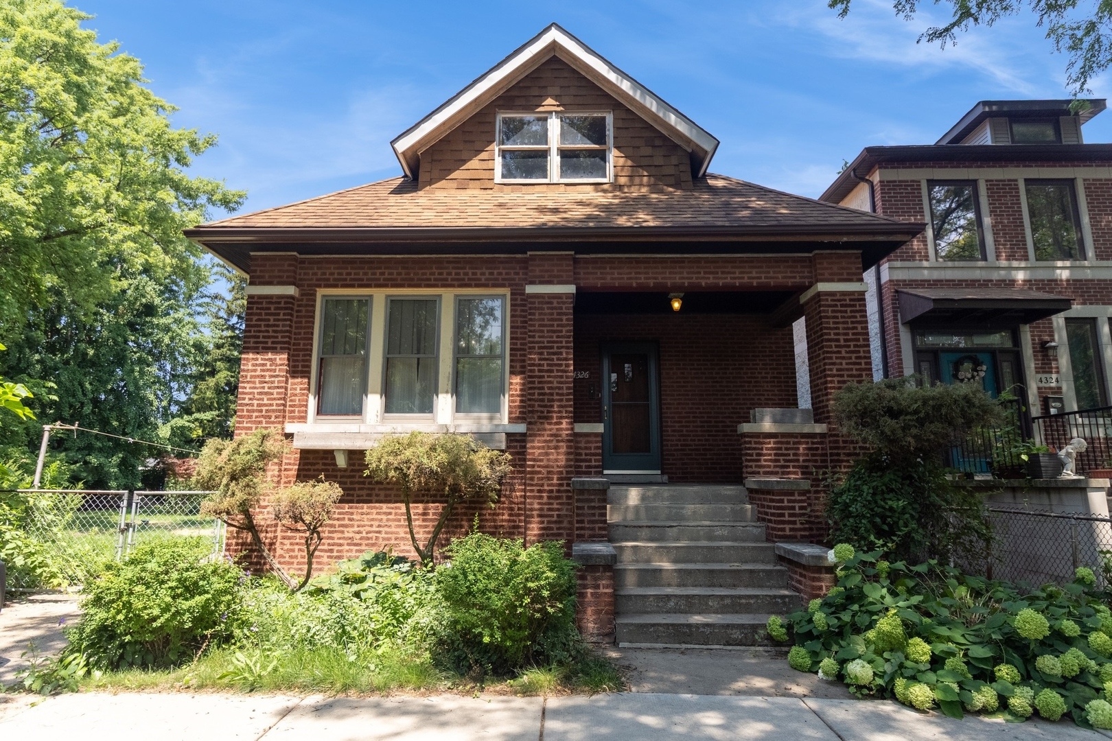 Incredible opportunity to custom build in booming Kilbourn Park. Tucked away on a quiet, tree-lined cul-de-sac, this one-of-a-kind property spans three separate lots (4326, 4328 & 4330) - offering unparalleled space, privacy, and potential. This classic brick bungalow features an extra-wide footprint with spacious living and dining areas, abundant closet space, and charming vintage details throughout. The full attic, already equipped with a stairwell and tall ceilings, provides the perfect blank canvas to create an impressive primary suite and additional bed and bath - effectively doubling the home's livable space. The basement also features generous ceiling height, making it ideal for finishing into a large family room, guest suite, or home office. Outside, a solid brick two-car garage anchors the expansive outdoor space. With the additional lots, you have the rare opportunity to design your dream backyard oasis, build a guest house, or significantly expand the existing structure. Amazing Kilbourn Park location, tucked between Avondale and Old Irving Park with easy access to the blue line and 90/94. Whether you're looking to create a multi-generational home, add investment value, or simply enjoy unmatched outdoor space in the city - the possibilities here are truly endless.