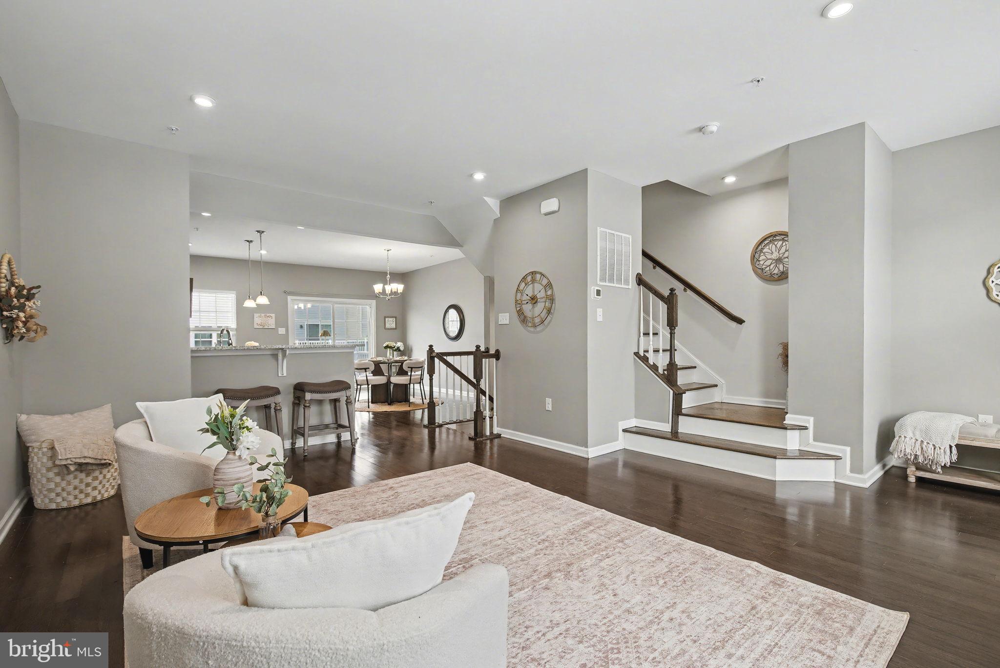Welcome Home to This Beautifully Updated 3-Bedroom Fillmore Village Townhome!Just minutes from the heart of downtown Phoenixville, this beautifully updated three-story townhome offers modern comfort, thoughtful design, and an unbeatable location. Step inside to a cozy entry-level bonus room - the perfect flex space for a home office, gym, or media room. Upstairs, the light-filled main living area features an open-concept layout with a spacious living room, gourmet kitchen, and dining area that seamlessly flow together. The kitchen shines with modern finishes, granite countertops, ample cabinetry, gas cooking, and a large island - ideal for both casual meals and entertaining. From the dining area, step through sliding glass doors to your large private deck, the perfect spot to unwind and catch the sunset after a long day.  On the third level, the primary suite impresses with a tray ceiling, generous walk-in closet, and a spa-like en-suite bath featuring dual sinks and a relaxing shower. Two additional bedrooms provide versatile space for guests, a home office, or hobbies, while a hall bath and second-floor laundry add everyday convenience. Additional highlights include a two-car garage, abundant closet space, and low-maintenance living within the desirable Fillmore Village community - where roof and exterior maintenance are all covered by the HOA! A recently approved HOA screening project will add front yard privacy as 18 Arborvitae trees among other lush greenery are planned to line the sidewalk. Enjoy being just minutes from Phoenixville’s vibrant downtown - with its charming shops, restaurants, and entertainment - the Schuylkill River Trail - a great spot for running, walking, biking and enjoying nature - plus easy access to major routes for commuting. Move right in and start enjoying all that this wonderful home and location have to offer!