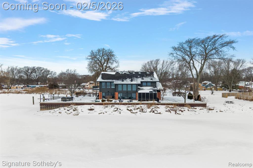 Breathtaking lakefront retreat with 250 feet of incredible Lake Saint Clair frontage and panoramic views! This custom designed home features a brand new sea wall, boat hoist, dock and Trex deck! Spacious open floor plan with an abundance of natural light and floor to ceiling sky lights.  Large chef’s kitchen with custom cabinets and granite and quartz counters, new Viking and sub-zero appliances.  Family room features custom built-in cabinets.  Primary bedroom boasts two large walk-in closets, his/hers bathrooms and a private balcony with stunning lake views.  Massive second floor flex room, a lakeside screen porch, and a large 4 car heated garage make this property an absolute must see.  Recent upgrades also include oak flooring throughout, ventless gas fireplace, whole house Generac system, full roof replacement, exterior painting, interior painting, new air conditioning and furnace, hot water heater, Sundance hot tub, gutter guards and windows!