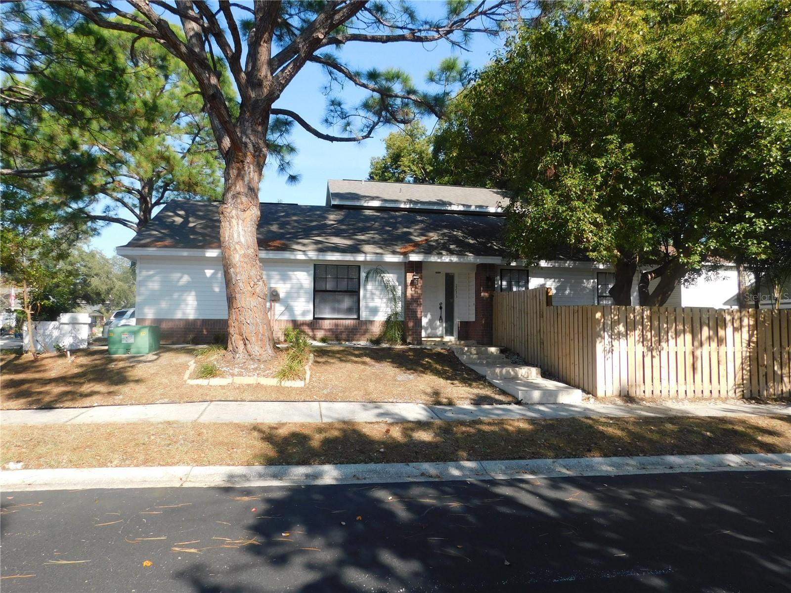 This is your chance to live in this highly sought after neighborhood! Come see this gem on a corner lot in a storybook community, tucked away from busy roads but still close to all Clearwater has to enjoy. With a community pool and great neighbors, this modern two - story home is bright with soaring ceilings, elegant lighting and a custom electric fireplace. The second floor is completely devoted to a large master suite with a walk in closet and a huge master bath with new vanities, a spa tub and shower. Downstairs you will find the kitchen with all brand news appliances, two more bedrooms plus a large utility/bonus room that could serve many purposes. The home has recently been given a NEW ROOF, NEW AC, NEW WASHER/DRYER, NEW EXTERIOR SIDING and all NEW KITCHEN APPLIANCES for your peace of mind. All of the hard and expensive things have been done, and it just needs some finishing cosmetic touches to be your perfect house. Don’t forget to get some much needed relaxation time in the lush back yard with a new travertine patio and mature trees. Don't miss the community pool, basketball/tennis courts and clubhouse for parties, all for a very low HOA!. Come see this standout today!