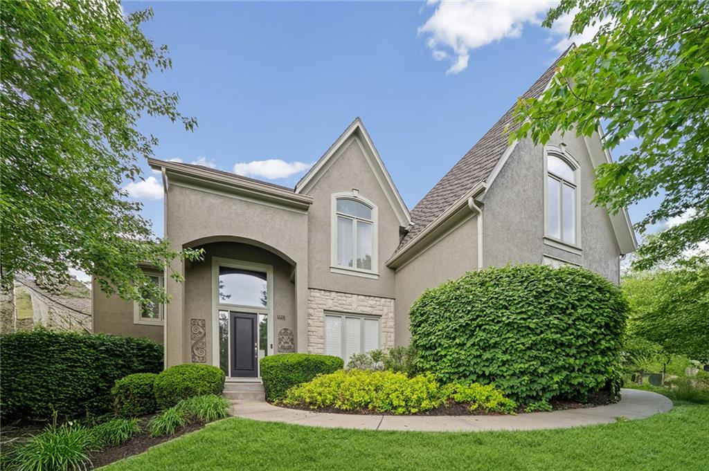 Nestled in the heart of historic and charming Parkville, this luxurious Riss Lake estate has been professionally remodeled from top to bottom with impressive updates throughout. The main level showcases freshly refinished hardwood flooring, fresh interior paint across all three levels, new carpet, updated light fixtures, new stair treads, and new spindles. The kitchen showcases quartz countertops, Major exterior improvements include a brand-new roof, new exterior paint, upgraded deck, gutters, and leaf guards.The spacious primary suite is a true retreat, featuring an approximately 15x18 bedroom plus a 13x12 bonus sitting room. The completely remodeled primary bath offers heated tile floors, separate dual vanities, a high-end soaker tub, elegant marble finishes, and a luxurious shower with three showerheads. Generous secondary bedroom suites each feature walk-in closets, providing comfort and functionality for everyone.The finished lower level is designed for entertaining, complete with a home theater, full wet bar, and an unforgettable bonus room with a rolling ladder leading to a U-shaped walkway overlooking the space, a feature sure to amaze kids of all ages. Lower level provides ample storage. Walk out to a rare spacious back yard.Located in the sought-after Riss Lake community, residents enjoy resort-style amenities including a private 138-acre lake, scenic walking trails, three pools, tennis courts, pickleball courts, playground, and convenient access to historic downtown Parkville.
