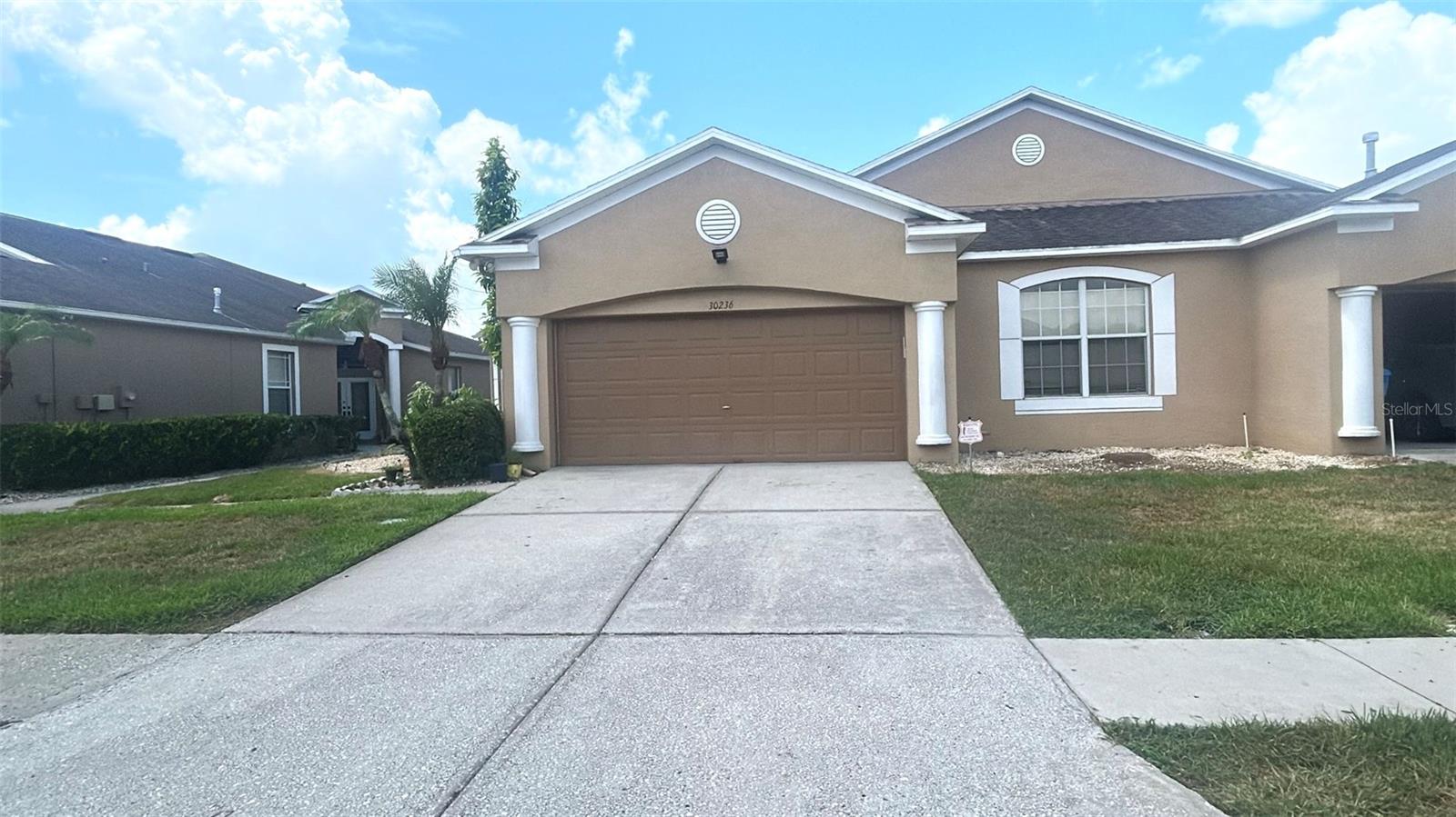 Welcome to this beautifully maintained 4-bedroom, 2-bath villa located in the highly desirable gated community of Lettingwell in Meadow Pointe II. Originally designed as a 3-bedroom home, this residence has been enhanced with a professionally added fourth bedroom, providing the perfect space for a growing family, guests, or a home office. Offering 1,743 square feet of thoughtfully designed living space, the home features an open floor plan with spacious living and dining areas, laminate flooring throughout, and a well-appointed kitchen with granite countertops, stainless steel appliances, a breakfast bar, and a large walk-in pantry.The spacious primary suite offers a large walk-in closet and an en-suite bath with dual vanities and a walk-in shower. Enjoy a partially fenced backyard, creating the perfect setting for relaxing or entertaining. Additional highlights include plantation shutters, a tankless water heater, an inside laundry room, and a rear-entry two-car garage.The HOA provides low-maintenance living by covering exterior maintenance, roof replacement, exterior painting, landscaping, and trash service.Located within the award-winning Meadow Pointe master-planned community, residents enjoy an exceptional lifestyle with on-site schools, scenic parks, nature preserves, tranquil ponds, multiple clubhouses, resort-style swimming pools, fitness centers, tennis and basketball courts, playgrounds, walking trails, and a variety of community activities. Conveniently located near top-rated schools, shopping, dining, hospitals, and major highways, with easy access to Tampa, downtown, and the Gulf Coast beaches.Move-in ready and loaded with desirable features, this home offers the perfect combination of comfort, convenience, and resort-style living.