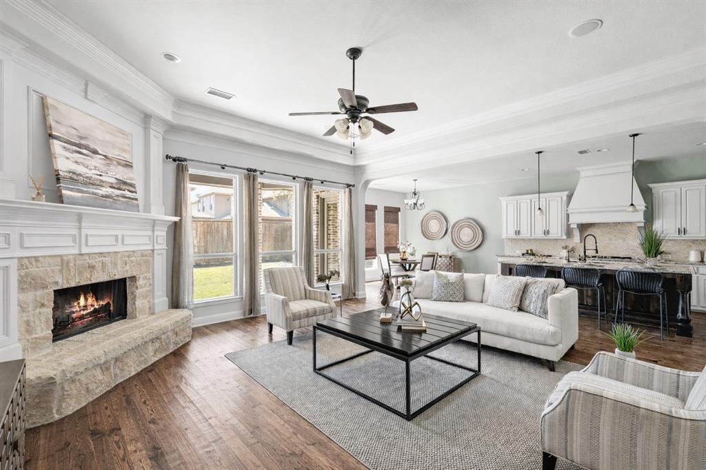 Welcome to this beautiful north-facing Shaddock home located in the highly desirable Villages of Stonelake Estates, where elegant design, thoughtful upgrades, & an exceptional floor plan create the perfect space for both everyday living & entertaining. A grand two-story entry welcomes you with soaring ceilings & a striking oversized solid mahogany front door with extended molding, setting the tone for the quality & craftsmanship found throughout the home. This spacious residence offers five bedrooms & multiple living areas designed for comfort & functionality, including an open-concept living room that flows seamlessly into the kitchen, a private home office, and expansive upstairs media & game rooms ideal for entertaining family & guests. The main level features a luxurious primary suite along with a secondary bedroom & full bath, perfect for guests or multigenerational living, while the second floor offers three additional bedrooms, a Jack-and-Jill bath, & an additional full bathroom. Beautiful architectural details include hardwood flooring, tray ceilings, & extensive crown molding that add warmth & sophistication throughout the home. The chef’s kitchen is thoughtfully designed with custom cabinetry, double ovens, a five-burner gas cooktop, under-cabinet lighting, a walk-in pantry, & a large center island perfect for meal preparation, casual dining, & hosting gatherings. The impressive multi-level media room with theater lighting is fully equipped for the ultimate movie night experience, making it a standout feature for entertainment. Additional highlights include a tankless water heater, a 2019 roof, refrigerator included, fresh interior paint completed in 2025, & new carpet installed in the primary bedroom & upstairs in 2026. Perfectly located just steps from the neighborhood park & greenspace & within walking distance to highly rated Frisco ISD schools, this exceptional home offers luxury, space, & convenience in one of Frisco’s most sought-after communities.