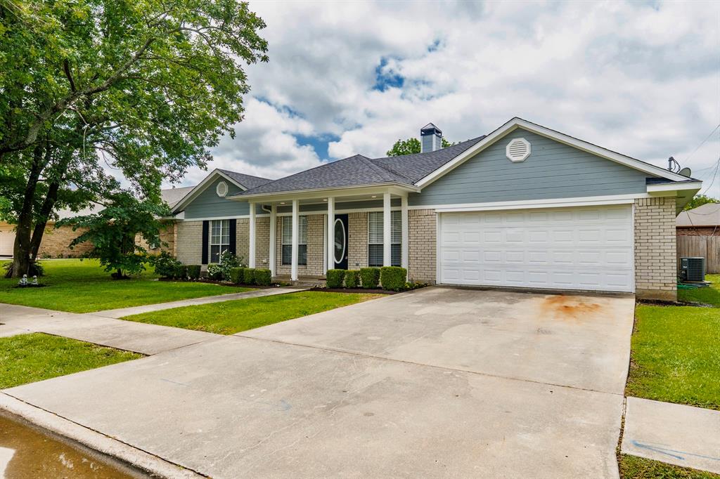 Come see this updated 3 bedroom, 2 bathroom, with 2,109 square feet, tucked inside Woodbridge Crossing subdivision! There is a bonus room off the kitchen that would be a great home office, home gym, kids playroom, or den. A wood-burning fireplace, recessed lights, and wood laminate floors make the living room a great space. From a bright and fresh kitchen, with light tile and cabinets, you’ll find granite countertops, an island, and stainless steel appliances.  The primary bedroom includes a trey ceiling, wood laminate flooring, ceiling fan and bathroom with split double sinks, ceramic tile, and walk-in closet. For additional privacy, the primary bedroom is split from the guest bedrooms. A spacious backyard comes with a large covered gazebo and wood privacy fence. Your lawn will be easier to care for with a built-in sprinkler system. Bring your fishing poles to the community lakes and enjoy a picnic under the covered pavilion!