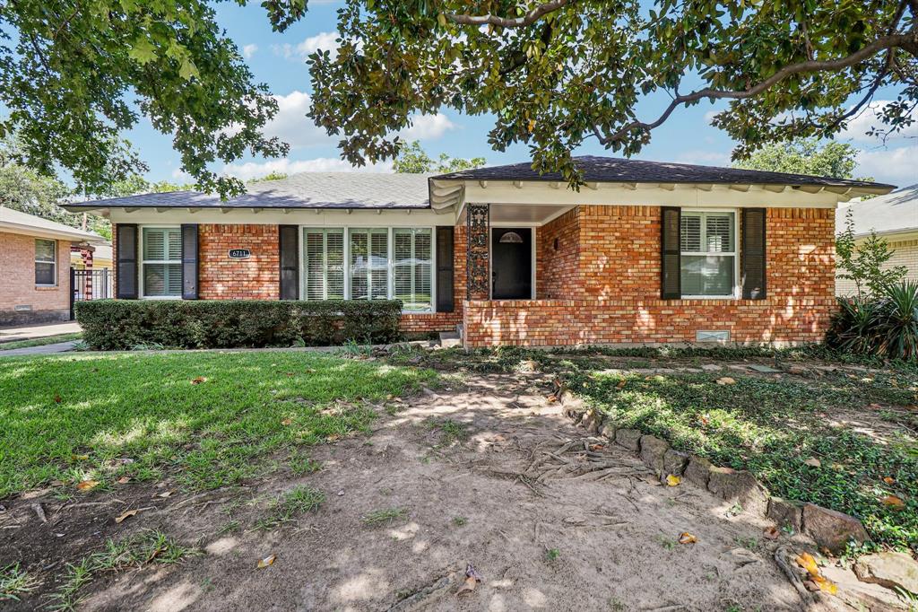 Charming cottage located near White Rock Lake, nestled on a lush, tree-filled lot. The interior boasts hardwood floors throughout, complemented by stylish designer paint. With two distinct living areas, the kitchen is a highlight, featuring dark cherry wood cabinets, recessed lighting, granite countertops, a polished ceramic tile backsplash, stainless steel appliances, a gas cooktop, and tile flooring. The home offers a split bedroom layout, enhanced by crown molding, plantation shutters, and custom closets. The fenced backyard is a gardener's dream, showcasing a diverse array of plants and trees, including lantana, oleander, sage, red tip photinias, and rose bushes. Ideally situated near shopping and dining, this property is also zoned for Lakewood Elementary.