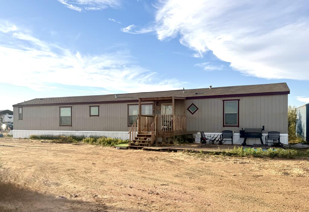 OVER 5 UNRESTRICTED ACRES IN DESIRED GREENWOOD.  Come make your home on this fantastic piece of tucked away property! A well-kept 2024 mobile home with 2 storage sheds, Conex box, 6 full RV hookups (2 covered) for additional income, endless possibilities, two entryways, privacy, and peace! A five-minute drive to gas, food, groceries, parks, and Greenwood schools. Property has enough power to be used for commercial purposes as well. It is definitely work seeing! Bring your animals, big toys, family, and dreams! Enjoy the West Texas sunsets in your own unrestricted backyard!