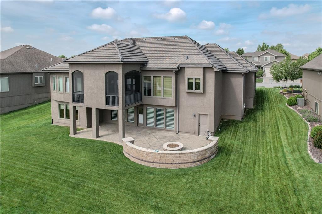 This stunning reverse 1.5-story home in Creekmoor offers an unparalleled blend of quality, elegance, & functionality. Perfectly positioned on a premium golf course lot, this meticulously maintained home backs to a serene pond & Hole 17 of Creekmoor’s award-winning golf course, providing breathtaking views & a tranquil setting. Built to last, this home is engineered w/48 structural piers & is the only home in the neighborhood w/a durable tile roof, ensuring exceptional longevity & peace of mind. Constructed by C&M Builders, it showcases the coveted Pinebrook National floor plan, delivering high-end craftsmanship & thoughtful design throughout. Featuring four bedrooms & four full & one half bathrooms, this home is designed for comfort & convenience. The main level offers two bedrooms, including a luxurious master suite w/heated tile floors in the master bath & private access to the outdoor living space w/a fireplace. The gourmet kitchen is beautifully appointed with stainless steel appliances, granite countertops, a walk-in pantry w/a grocery door, & tile floors. The w/o basement is perfect for entertaining, featuring a full bar, two additional bedrooms, & seamless access to the expanded stamped patio with a built-in stone firepit, where you can relax & take in the stunning golf course views. A lanai extends the indoor-outdoor experience, making this home ideal for year-round enjoyment. The expanded garage includes built-in shelving, epoxy floors, & a suspended garage floor, offering ample storage and functionality. Located in the sought-after Creekmoor community, this home provides access to resort-style amenities, including multiple pools, a clubhouse & Creekmoor Tavern for your dining & events, a fitness center, scenic trails, & a play area, all centered around a championship golf course. You simply cannot rebuild this home at this price! Don’t miss this rare opportunity to own a home that offers unmatched quality, luxury, & lifestyle.