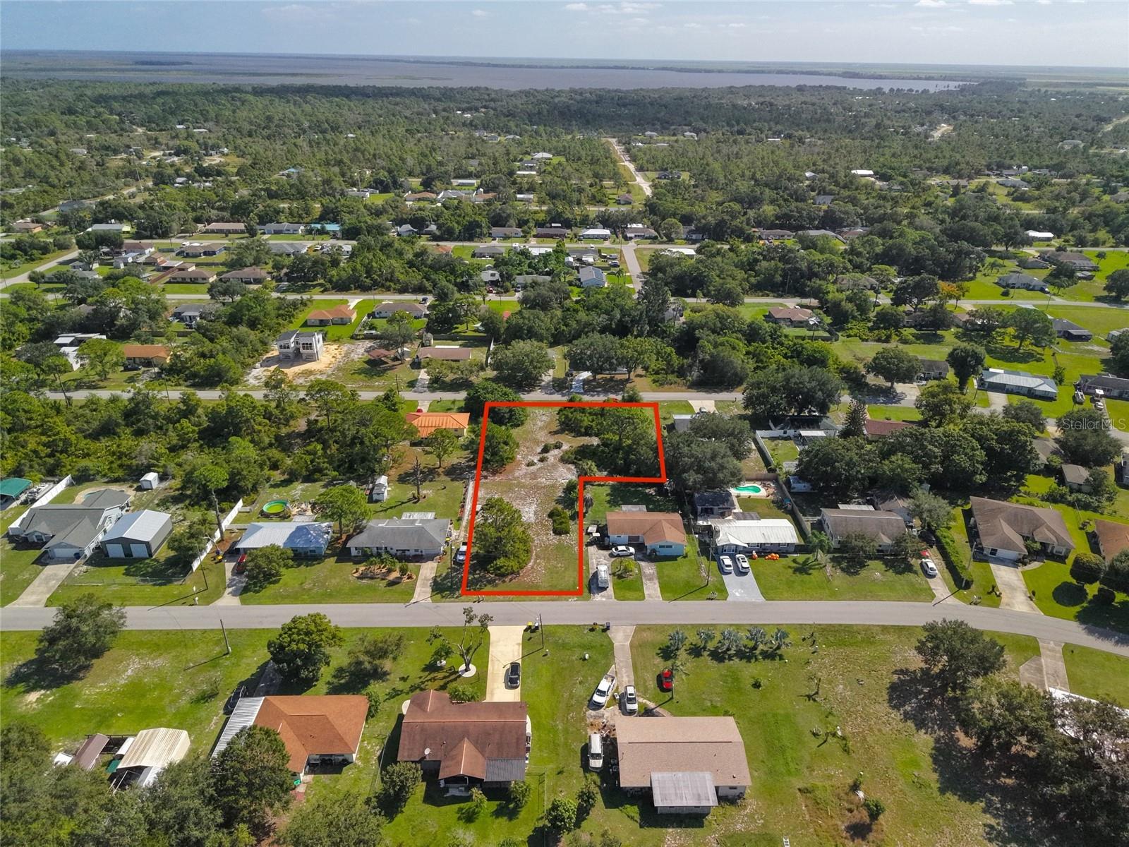 THREE LOTS • ENDLESS POSSIBILITIES! Rare opportunity for builders and investors in established Sylvan Shores! This prime development property features three adjoining lots, each approximately 80' x 125', with dual paved road frontage. Two side-by-side lots offer 160 feet of frontage with the potential room for a drive-through garage and RV storage. Partially cleared, the property may save you thousands in site preparation costs. Build one home with room for a pool, barn, or detached garage; two homes with shared space for boats and RVs; or three homes for potential rental income. Hold for future investment or share with family. Electricity is nearby; well and septic are needed. Conveniently located near Lake Clay's public boat ramp and downtown Lake Placid's shops, restaurants, and medical facilities. Enjoy the charm of the Town of Murals and Highlands County's year-round festivals and events. Three lots, countless possibilities—bring your vision and make your move today! Buyer to verify zoning, buildability, lot division, and intended uses.