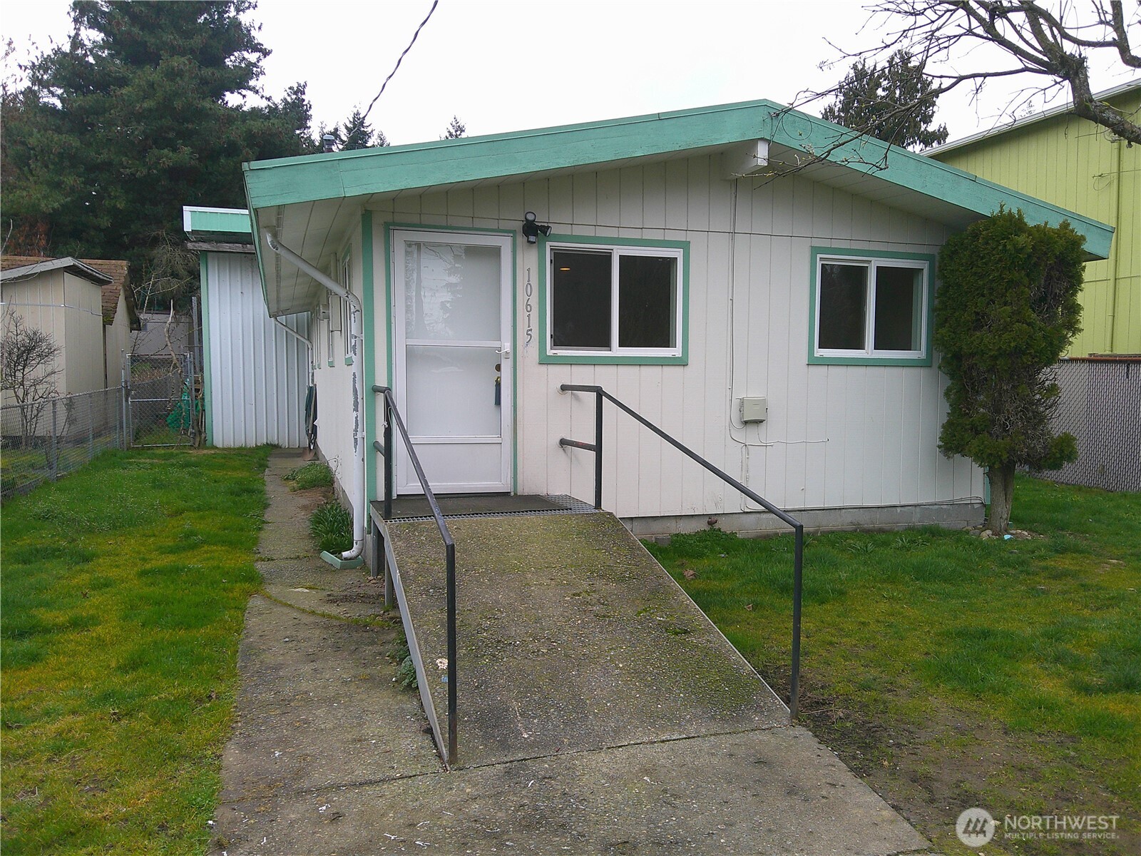 Very nice bungalow rambler.  New paint, newer heating and all appliances included. 2 bedrooms and bath all updated. Completely fenced yard with secured out building, dog run and 3-4 vehicle parking. 930 square foot, first class shop; terrific auto mechanic or trades work.  3/4 bath in shop. Overhead steel beam , workbench and much storage. 16' + ceilings and oversized steel shop door. Covered patio between house and shop. Separate laundry room off patio.  Alley access for shop with parking.