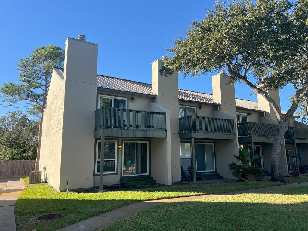 Discover this charming condo in the prestigious Gardens of Lakeside at Rockport Country Club! Boasting an exceptional view of the sparkling community pool. The thoughtfully designed layout features downstairs a cozy living-dining space with wood burning fireplace adds to the relaxing vibe, while enjoying morning coffee on the patio right by the community pool, and as you go upstairs your retreat with two bedrooms and a full bath. Located in a private 18 holes golf community, you're just a short drive to Rockport's pristine beach, vibrant shops, delicious restaurants, world-class fishing bays, and scenic Hike & Bike trails. Embrace the Rockport-Fulton lifestyle and make this your coastal getaway or full time home! Welcome home!