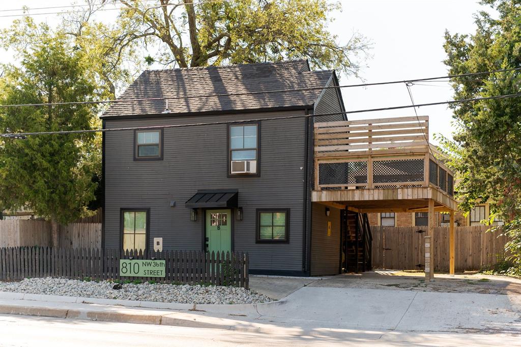 A rare opportunity to own four turn-key doors in one incredible property. Fronting Eubanks is a historic Tudor duplex with two side-by-side units—each offering two bedrooms and one full bath. Both are currently occupied by long-term tenants, providing immediate stability. Just beyond a privacy fence, facing NW 36th, sits the “back house,” a two-unit setup with an upstairs and downstairs layout. Each features a studio-style bedroom, one bath, and open living and kitchen spaces. These units operate as short-term rentals and have been thoughtfully remodeled with bright pops of color, charming appliances, and playful tile work that give them undeniable character. *Do NOT disturb tenants. These are occupied dwellings and you will need an approved appointment to tour*.