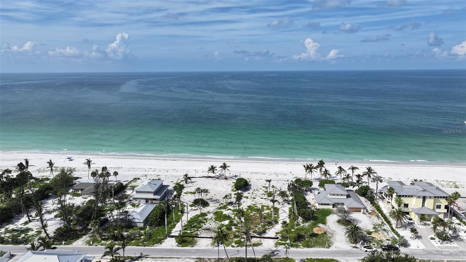 Build your dream beachfront estate on nearly three-quarters of an acre on exclusive North Longboat Key. With 100 feet of private Gulf frontage, this rare homesite offers endless views of turquoise waters spectacular sunsets and direct access to powder sand just steps from your future doorstep.Set within a rising luxury enclave, this prime property is moments from the new St. Regis Resort and the Longboat Key Club, offering world-class golf, tennis, dining, and five-star amenities. Enjoy the charm of nearby Anna Maria Island and the upscale shopping and cultural experiences of St. Armands Circle.This is one of the last opportunities to create a custom beachfront retreat in one of the Gulf Coast’s most coveted locations.