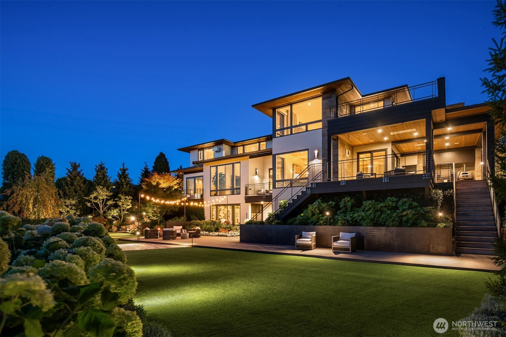 Behind the gate, this incredible collaboration of the owner & extraordinary design team awaits. Completely renovated in 2022 by Lucas Design & Lockhart Suver, clean lines frame the 50-yard-line view of Seattle, Lake Washington & the Olympic Mountains. Black steel & organic textures juxtaposed with a light palette create a perfect balance of drama & calm. Beyond the incredible design execution, a floor plan for today’s lifestyle: 5 bedroom suites, including luxurious primary with 180-degree views & private sun deck. 2 offices, speakeasy, media, exercise, wine cellar. Endless outdoor entertaining & pickleball. Artful landscaping by BYLA creates unparalleled privacy. A rare offering perched on over a half acre. The one you have waited for.
