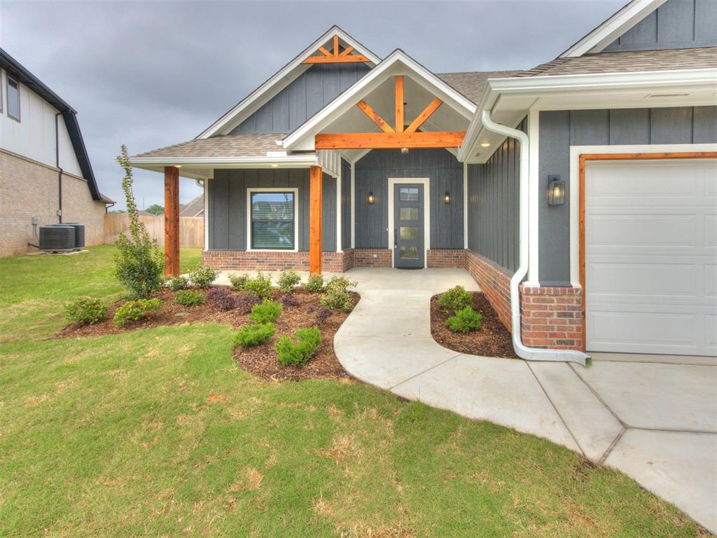 Welcome to Cedar Lane in South Norman, where thoughtful design and modern style come together in this stunning new construction home. Offering 4 bedrooms, 2 full bathrooms, and a convenient half bath for guests, this flexible floorplan is perfect for a variety of lifestyles. The fourth bedroom can easily serve as a dedicated study, giving you the ideal work from home setup without sacrificing space. As you step inside, you will immediately notice the open layout paired with tall ceilings and beautiful cathedral beams that create a bright and inviting atmosphere. Wood look tile flows throughout all high trafficked areas, combining durability with a warm, upscale feel. The living room is anchored by a striking floor to ceiling bricked fireplace that adds both character and a cozy focal point. The kitchen is designed to impress, featuring marble countertops, stylish pendant lighting, a vent hood, pot filler, and a spacious walk in pantry. Just off the 3 car garage entry, you will find a functional mud bench with coat hangers that helps keep everything organized. Primary bathroom showcases shiplap accents, black hardware, and a beautifully designed shower with basketweave floor tile. Primary closet is both practical and luxurious, complete with a built in dresser and direct access to the laundry room for everyday convenience. The laundry room itself stands out with charming tile and a folding counter, making daily tasks more enjoyable. Step outside to a large covered back patio that is perfect for relaxing or entertaining. The backyard backs directly to the community pool, and there is even the option to add a personal gate for easy access. The exterior features a 3 car garage, upgraded landscaping, and cedar post/accents that enhance curb appeal. Cedar Lane offers a welcoming community with walking paths and a handicap accessible playground, making it a great place to enjoy the outdoors.