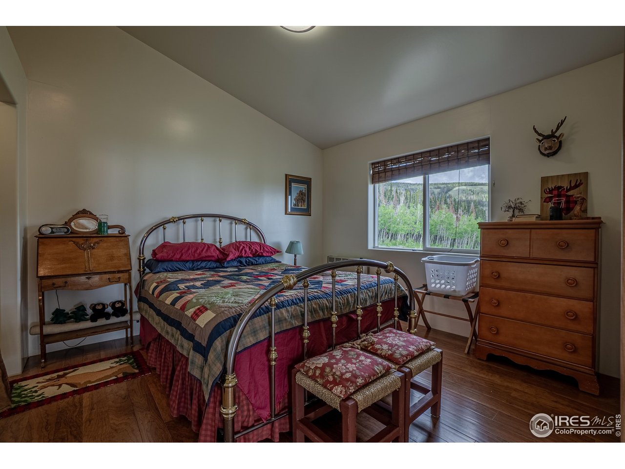 Tucked into the base of Bull Mountain in the Sand Creek area of north central Colorado, and 4 miles from Wyoming, this beautiful 72 acre property is waiting for you to take a peek. Little more than 30 minutes south Laramie, Wyoming at 8600' in elevation, you'll find a beautiful 3353 sqft off-grid yet fully utility-equipped home, complete with custom doors, cabinets, and high end finishes. With a well, septic, solar electrical system w backup generator, and propane, this home is not only ready to go, but has a very affordable utility infrastructure. There is also a 1200 sqft tall-walled metal building for all your toys or maybe even an RV. End of road privacy gives you the peace, security and serenity that's so hard to find these days. Imagine thousands of acres of National Forest around you, there is just no limit to the outdoor activities you can experience. Name it, hunting, fishing, camping, hiking, biking, mountain climbing and so much more...all outside your door. That doesn't even mention the winter sports such as cross country skiing and snowmobiling. Escape the summer heat in an area that seldom goes over 80.