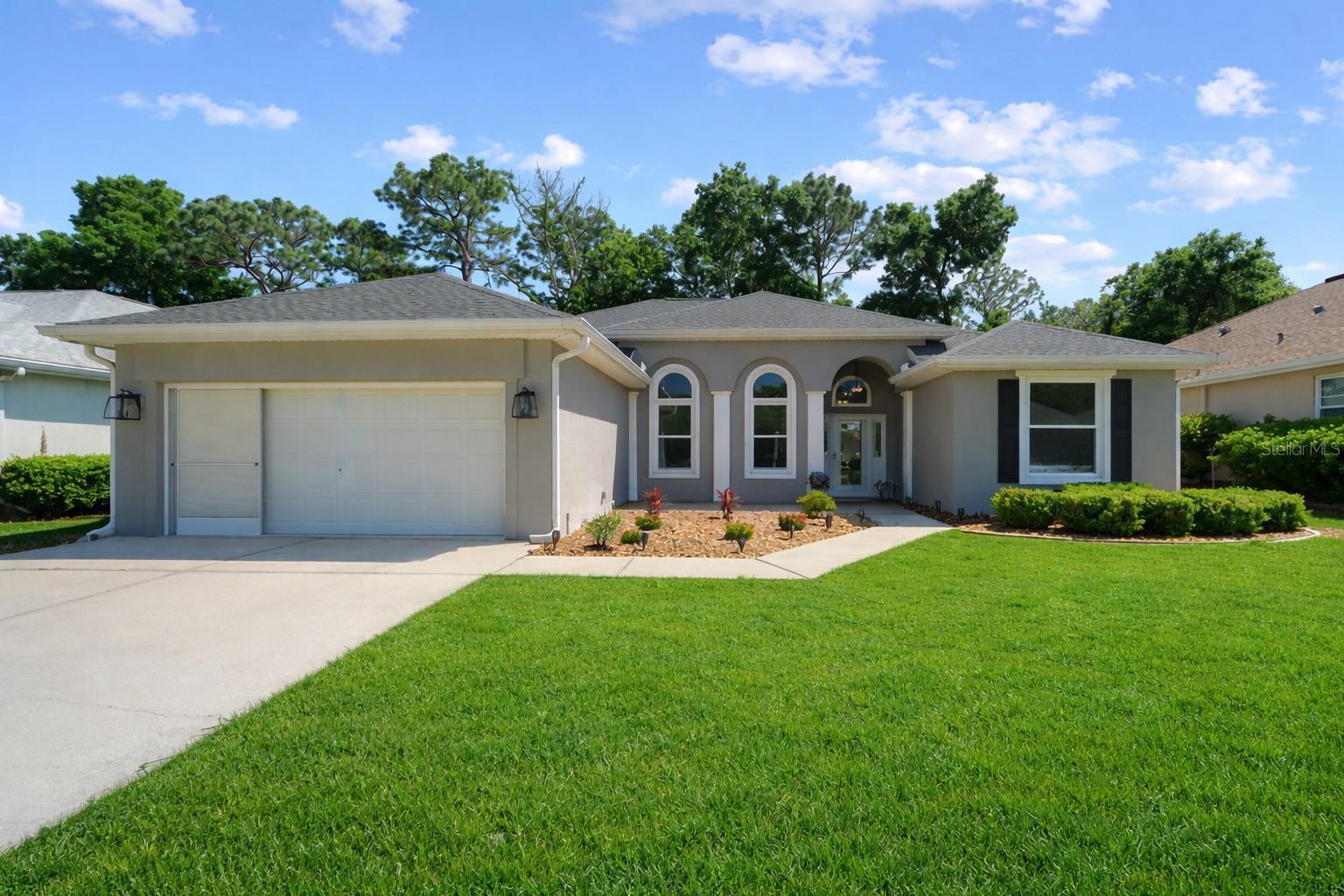 Welcome to the one you’ve been waiting for. This beautifully updated Capistrano in Laurel Oaks at Oak Run sits next to a peaceful preserve, offering rare privacy and serene views. Step inside to high ceilings, abundant natural light, and an open layout designed for both comfort and entertaining. The living room flows effortlessly through triple door sliders to a stunning enclosed Florida room. The kitchen shines with granite countertops, and a bright bay-window dining area with plantation shutters. The spacious primary suite features French doors, a tray ceiling, walk-in and separate shoe closets, and a beautifully updated bath with dual vanities. Guests will love the private bedroom and upgraded bath, while the versatile den (bonus room) with French doors is perfect for an office or flex space. Oak Run residents enjoy resort-style living with multiple pools, clubhouse, tennis courts, fitness centers, dog park, and so much more. All close to shopping, dining, and medical facilities. Schedule your viewing today!