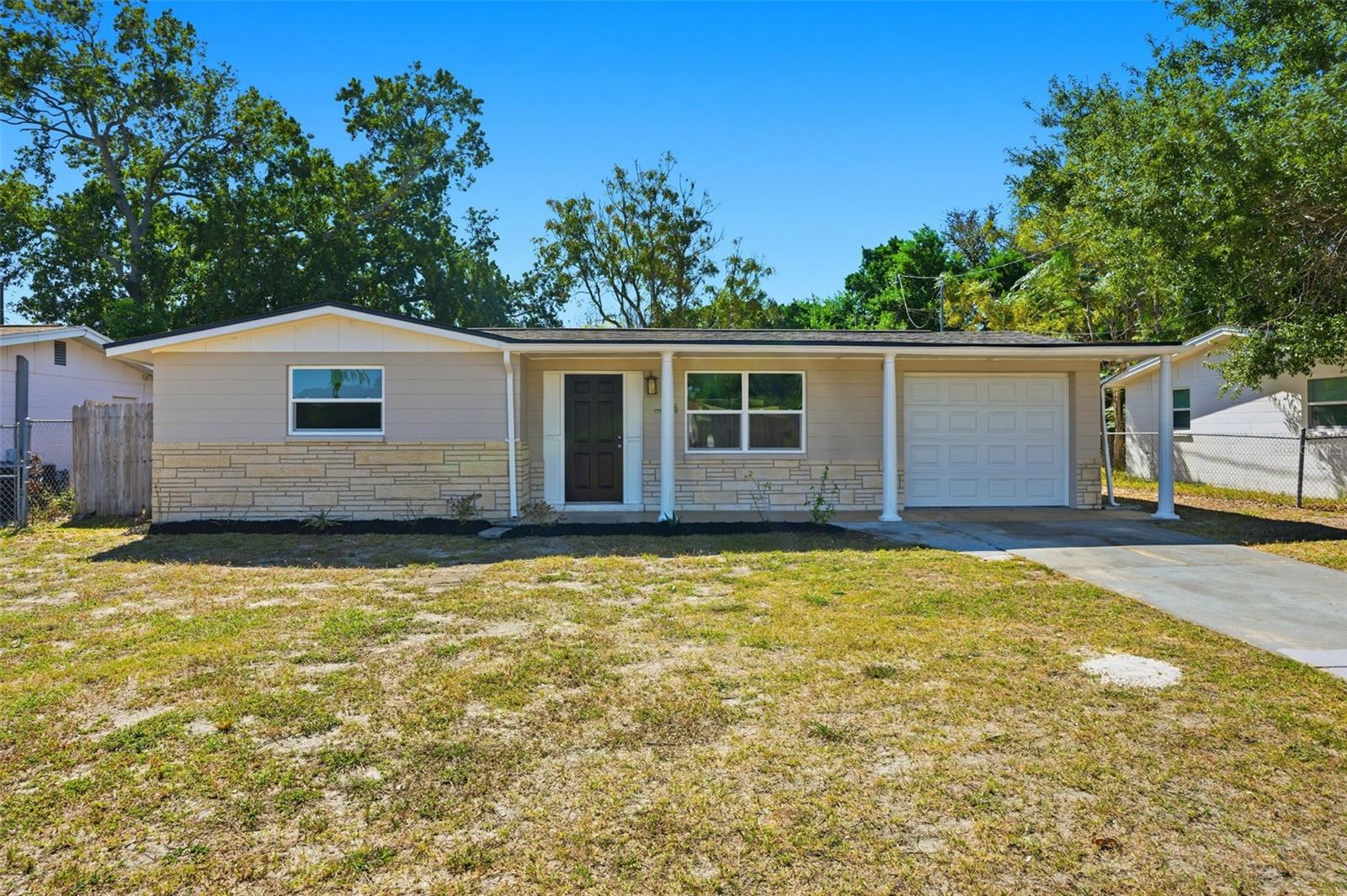 Newly remodeled, move in ready! Conveniently located half a mile from Hudson Beach, boat ramp, and waterfront dining with beautiful sunsets! This charming 2 bedroom, 1 bathroom home is located in Country Club Estates. Perfect for first time home buyers! This single family home offers comfortable living with new roof, garage door, windows throughout, and a stylish kitchen equipped with stainless steel appliances, solid countertops and full backsplash. Enjoy your evenings relaxing in the screened in back porch with fully fenced in backyard. Schedule your showing today!