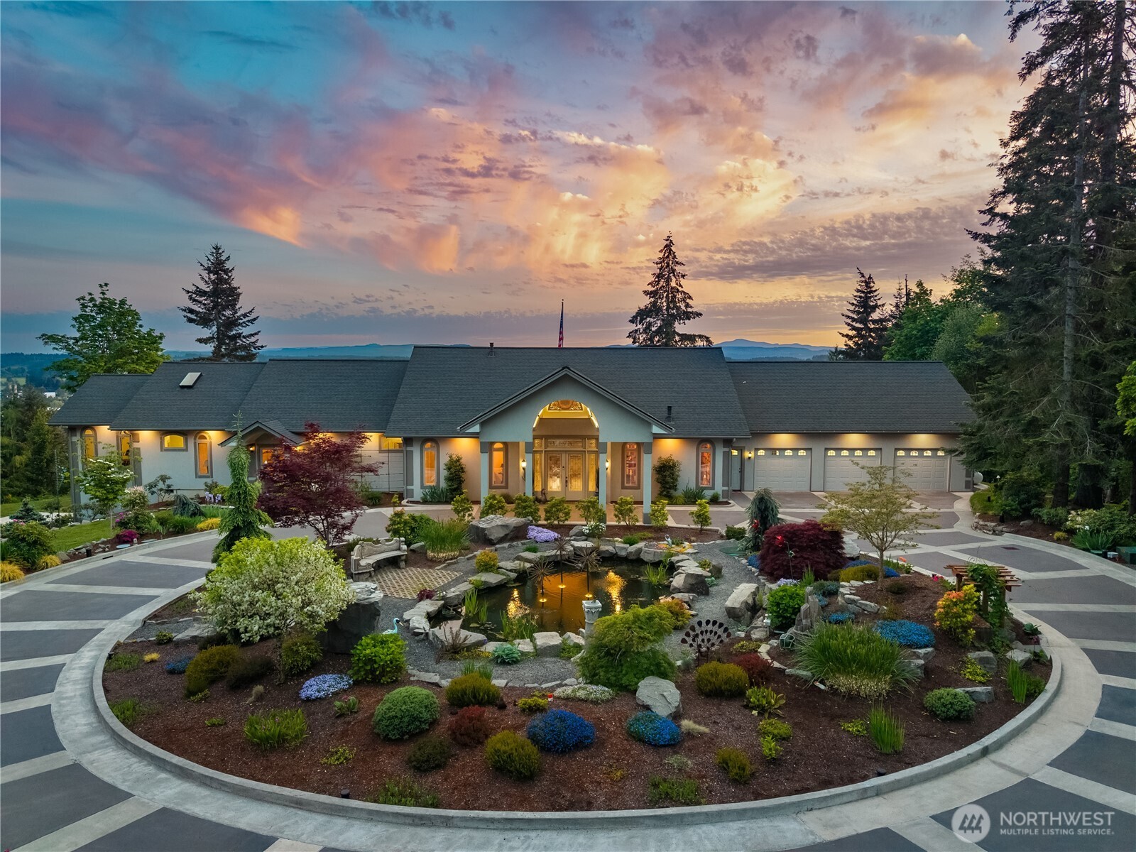 Welcome to this in town gem with 11 acres of privacy and views. Located in The Alderwood gated community, this tucked away prize is stunning in so many ways. 3,800 sq ft of single floor "no steps" living. Inside the home's private gated entry, the paved, treelined, sprinkled and lit private driveway leads to the home, built in 2020, greets you with beautiful landscaping, decorative paved roundabout leading to the porte cochere and then into the soaring grand entry foyer. Beautiful vistas from every room with automatic blinds on the West side of the home. Grand Primary complex has dual dressing rooms and a workout area/flex room. The two guest bedrooms both have 3/4 bathrooms with heated floors and step in tile showers. Granite counters everywhere, including the kitchen where their is ample space in the custom cabinets and butler pantry with refrigerator, sink and washer and dryer stack. Huge back patio has covered barbecue kitchen area with fridge/freezer closet, sink and eating bar. In addition to the main house there is a 600 sq ft stand alone lodge/ADU with full kitchen, 1 bedroom and 3/4 bath. Under The Lodge, there is a 1,200 sq ft shop garage w/a 1/2 bath, heat & ceiling height to accomodate a carlift. Main house has 1,280 sq ft garage with 1/2 bath and office. Additional attached and heated 24x22 heated garage is under the master bedroom complex. All totaled, 3,048 sq ft of heated garage space and 220V power capable of parking at least 7 vehicles in protected space.