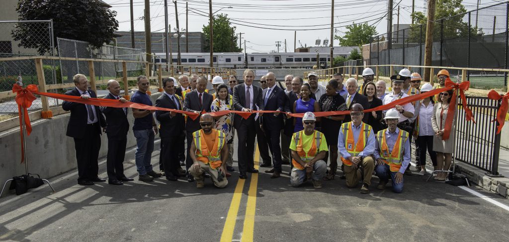 MTA Chief Development Officer Janno Lieber cuts the ribbon in a ceremony at Urban Avenue, marking the reopening of the roadway that now travels under the LIRR main line, the first of eight grade crossing eliminations to be completed as part of the $2.6 billion LIRR Expansion Project.
