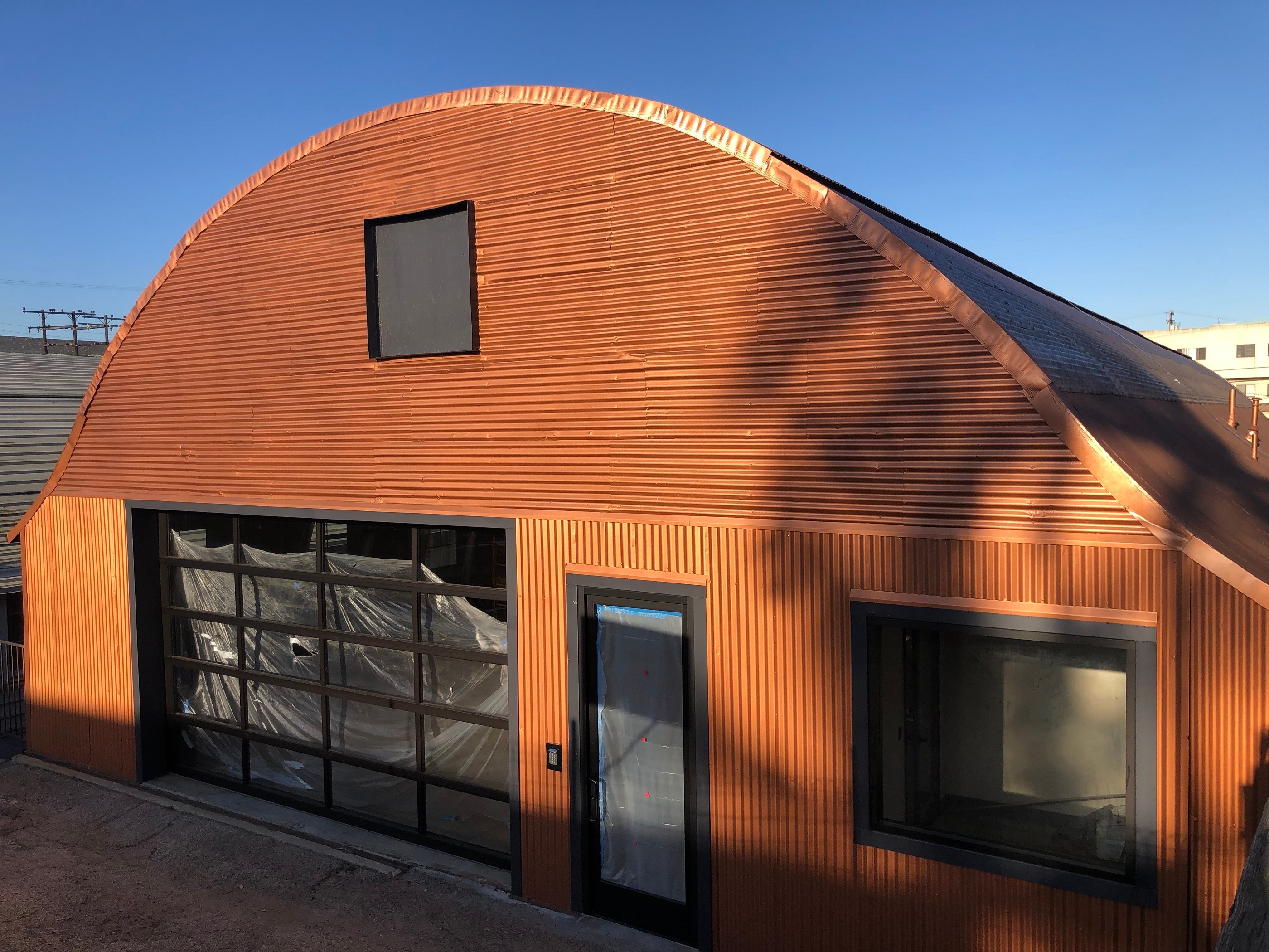Remodeled Quonset Hut Hangar with Copper Coating. Metallics & Patinas